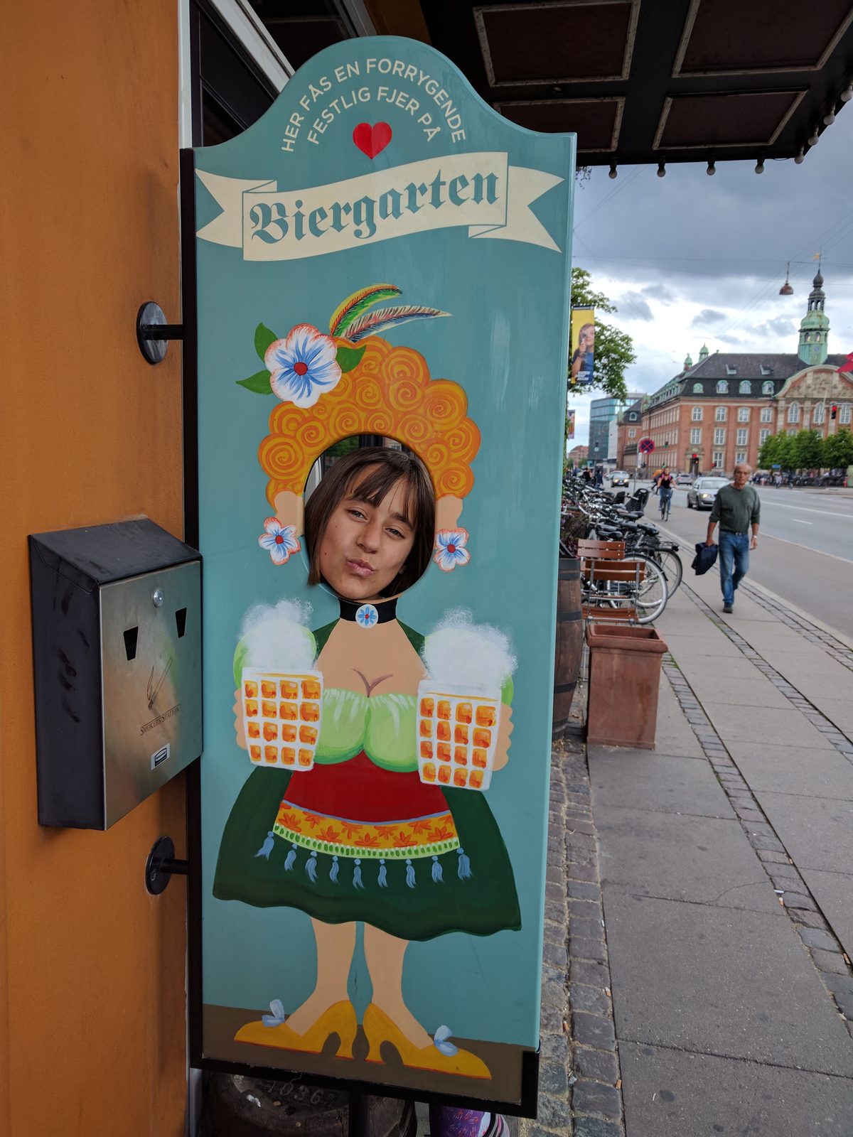 A biergarten sign painted on a doorway near Tivoli