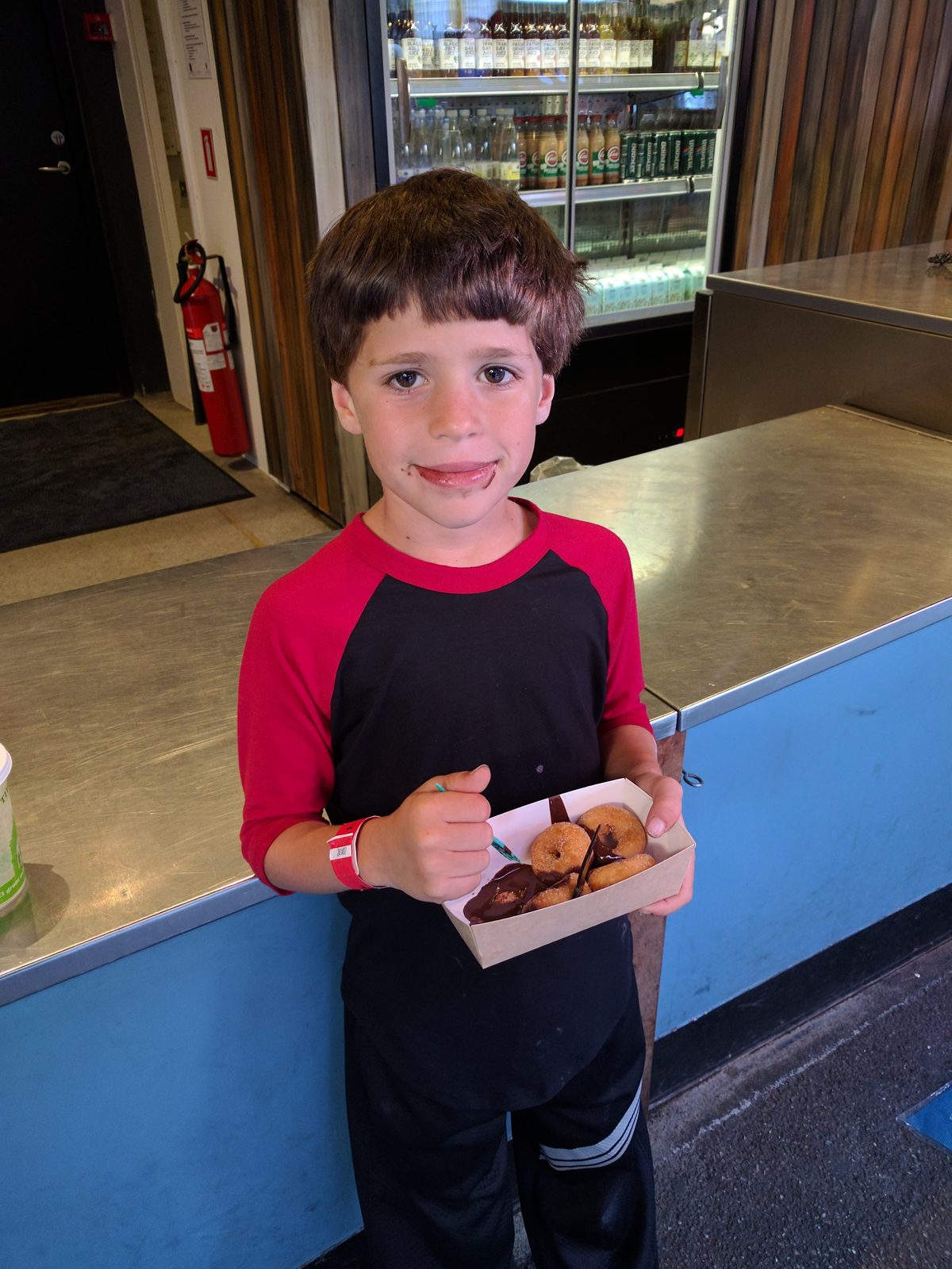 Thomas with mini donuts and chocolate sauce at Tivoli