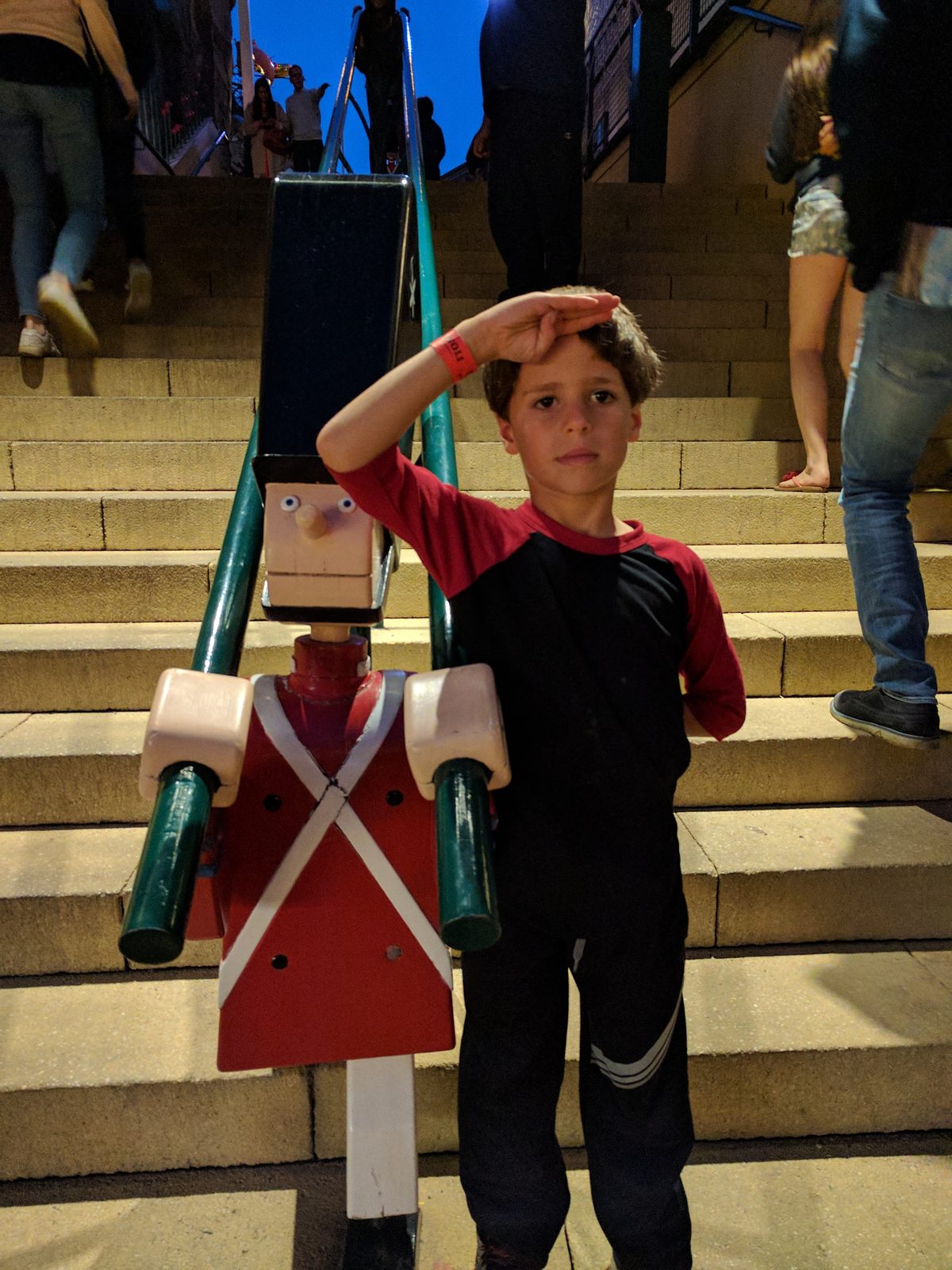 Thomas salutes the giant nutcracker soldier on the steps