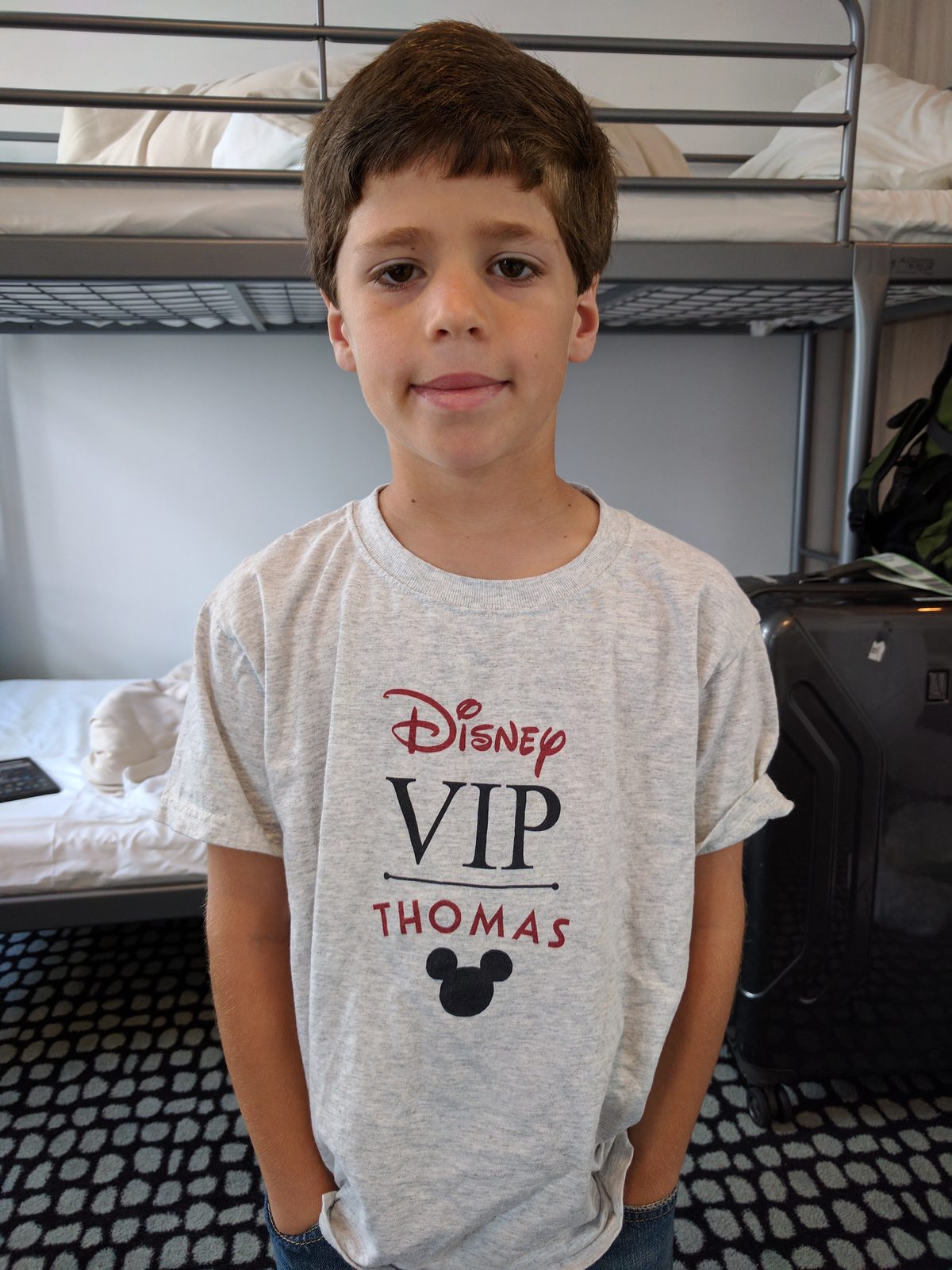 Thomas in his Disney VIP shirt, ready to board