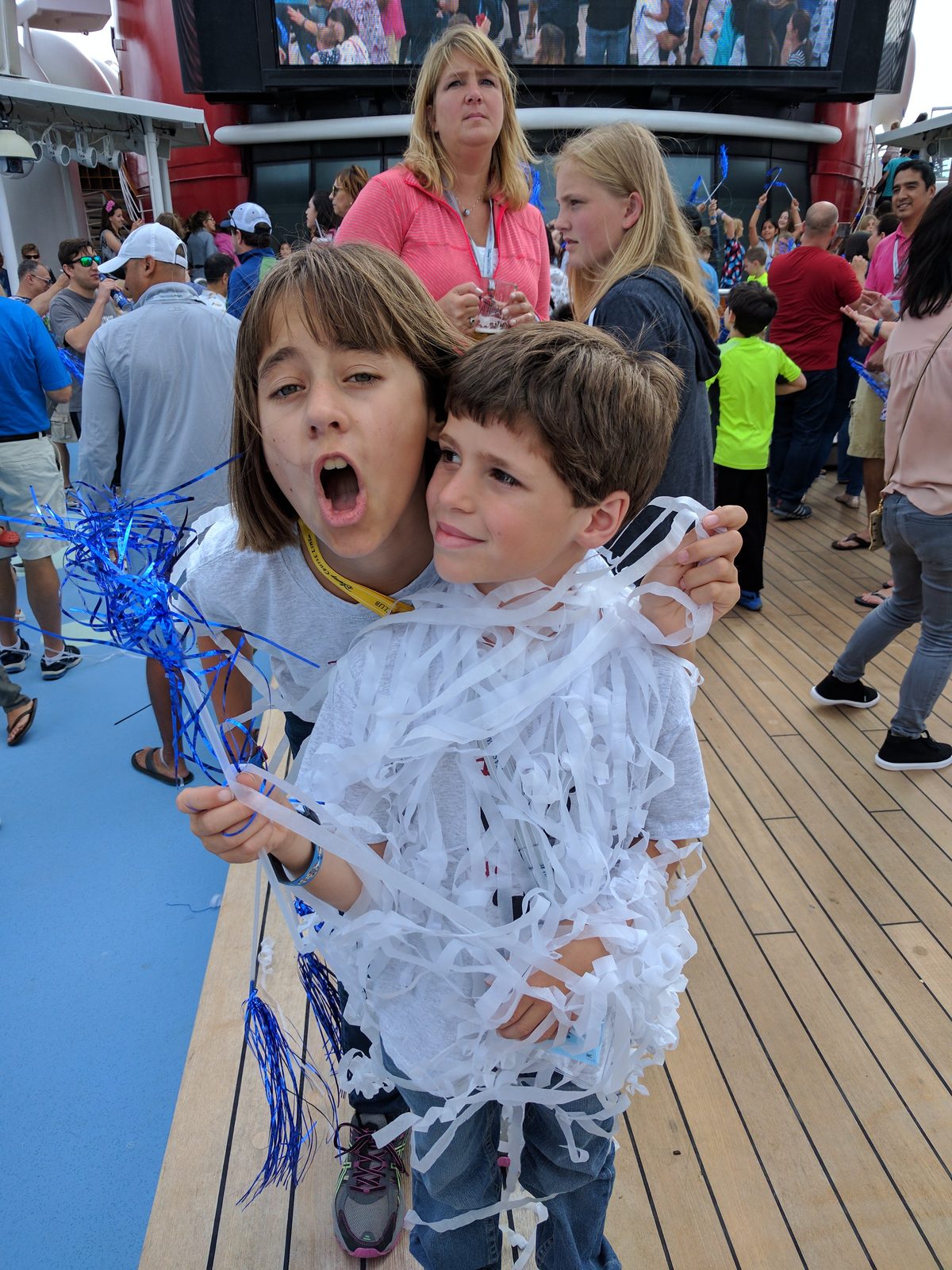 Lisa and Thomas covered in streamers at the Adventures Away deck party