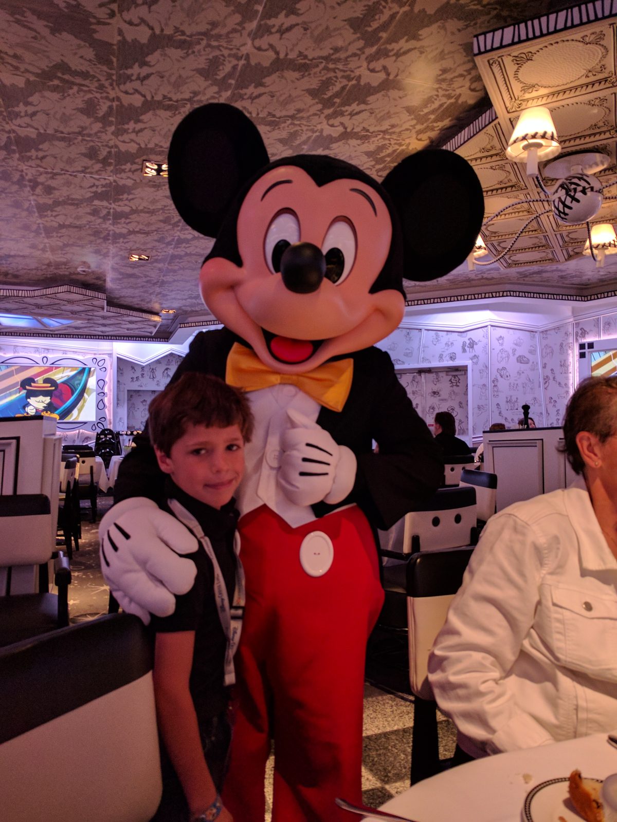 Thomas with Mickey in his tuxedo at character breakfast