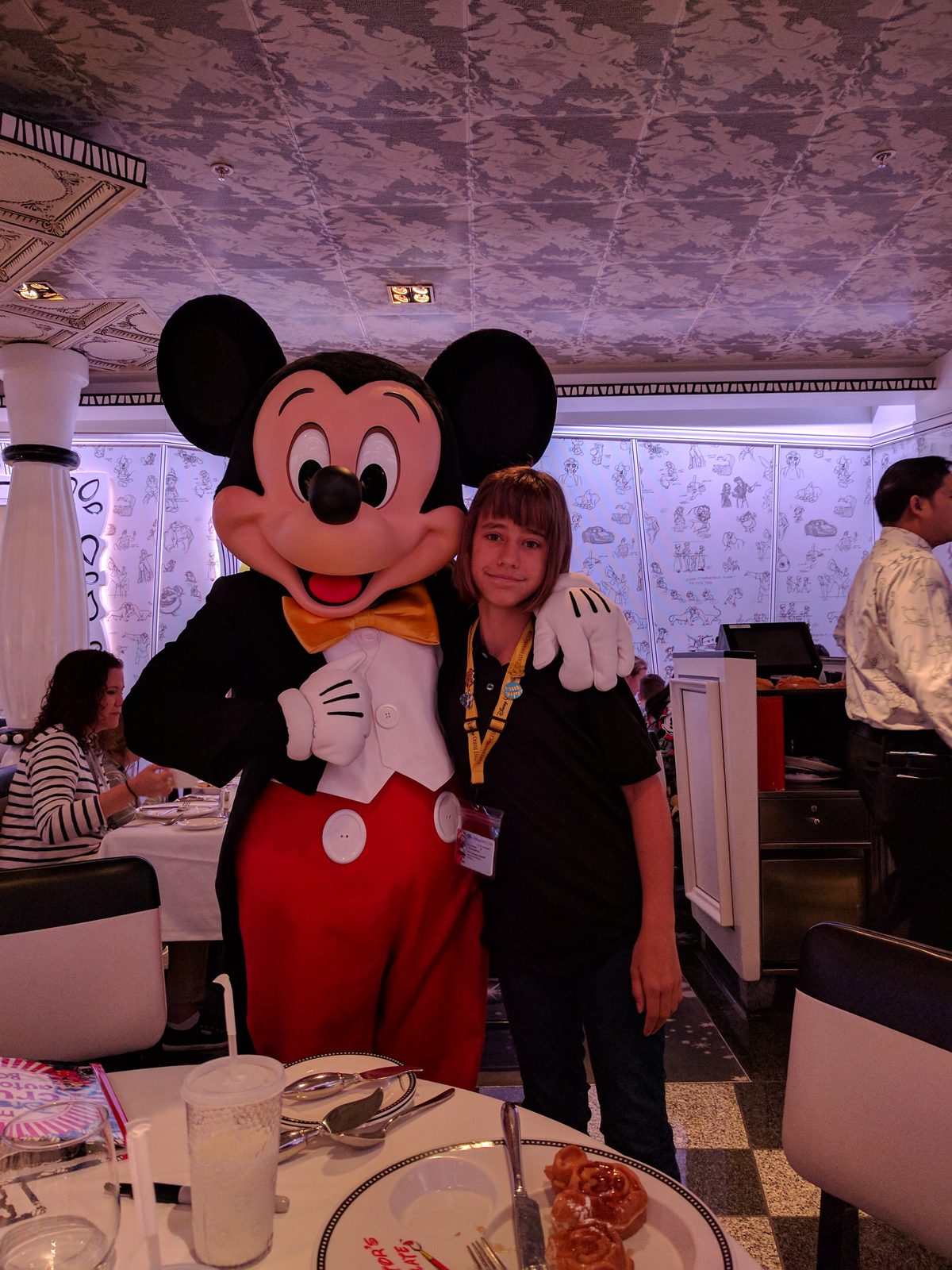 Lisa with Mickey in his tuxedo at character breakfast