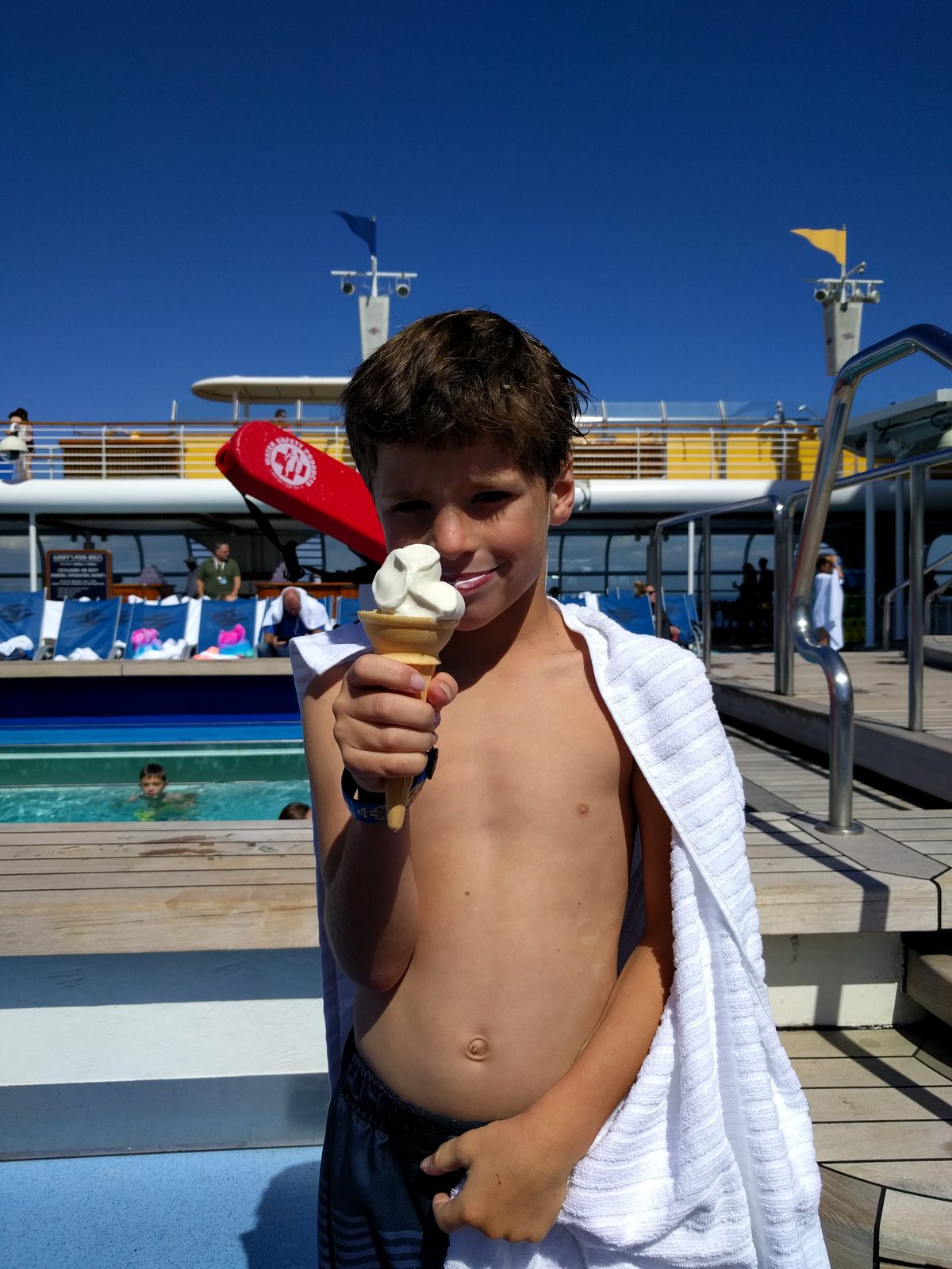 Thomas cools off with ice cream by the pool