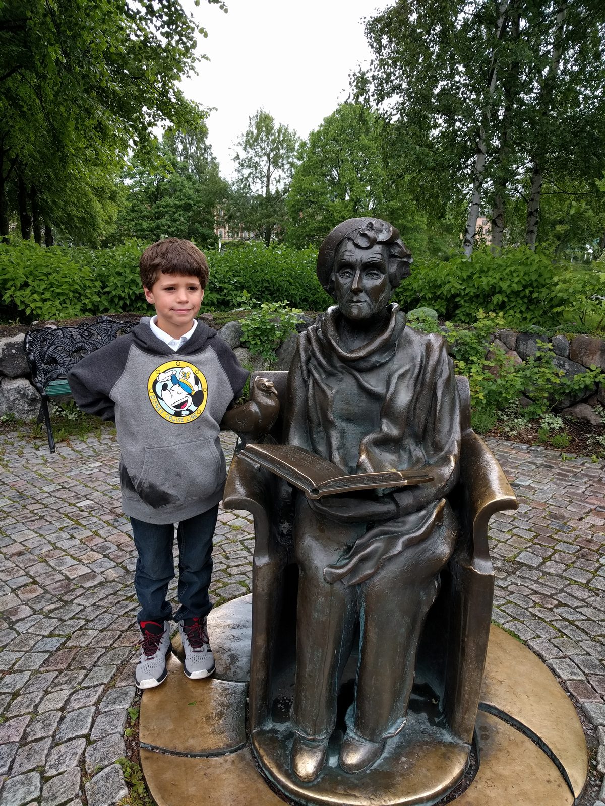 Thomas with the Astrid Lindgren statue outside Junibacken