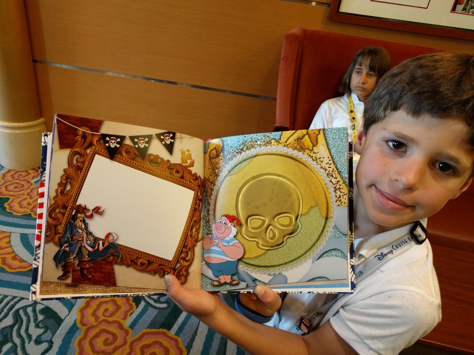 Thomas with his autograph book on the Magic, Lisa behind him