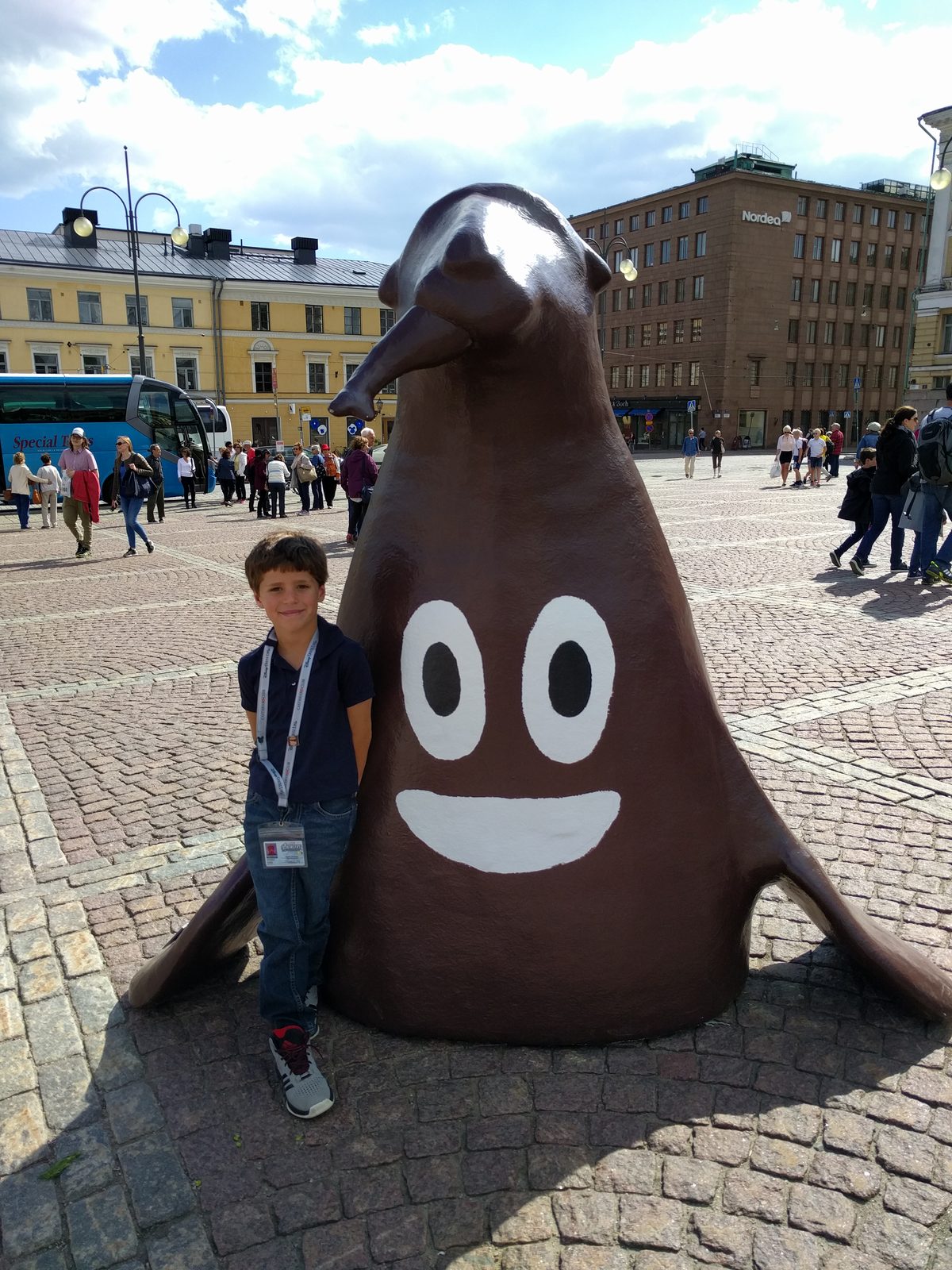 Thomas poses with a painted animal statue, Senate Square