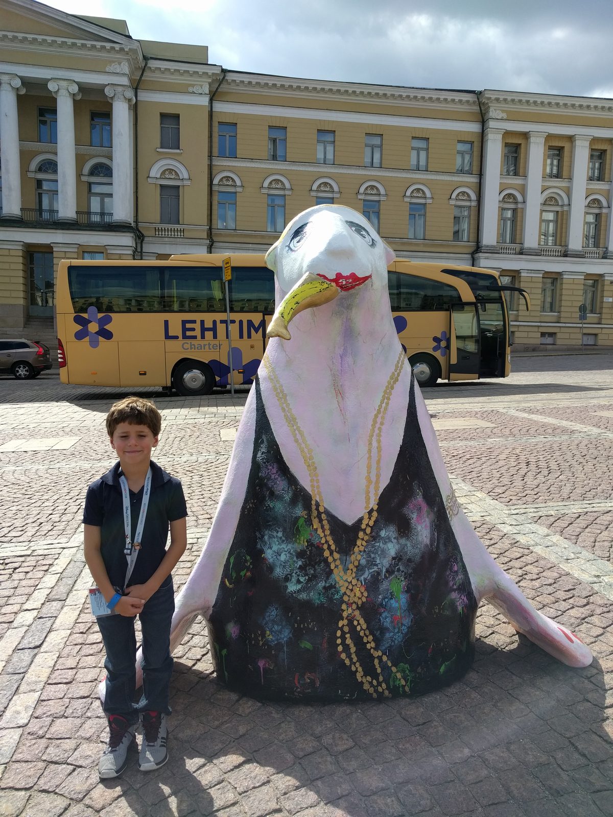 Thomas next to a giant seagull statue in Helsinki