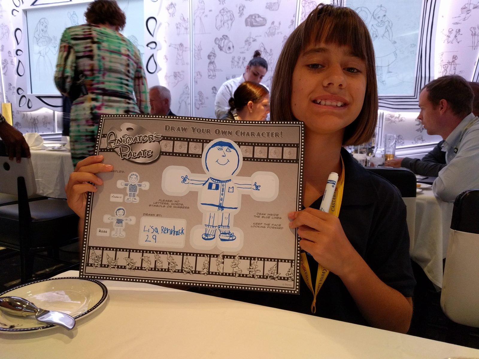 Lisa shows off her self-portrait from dinner