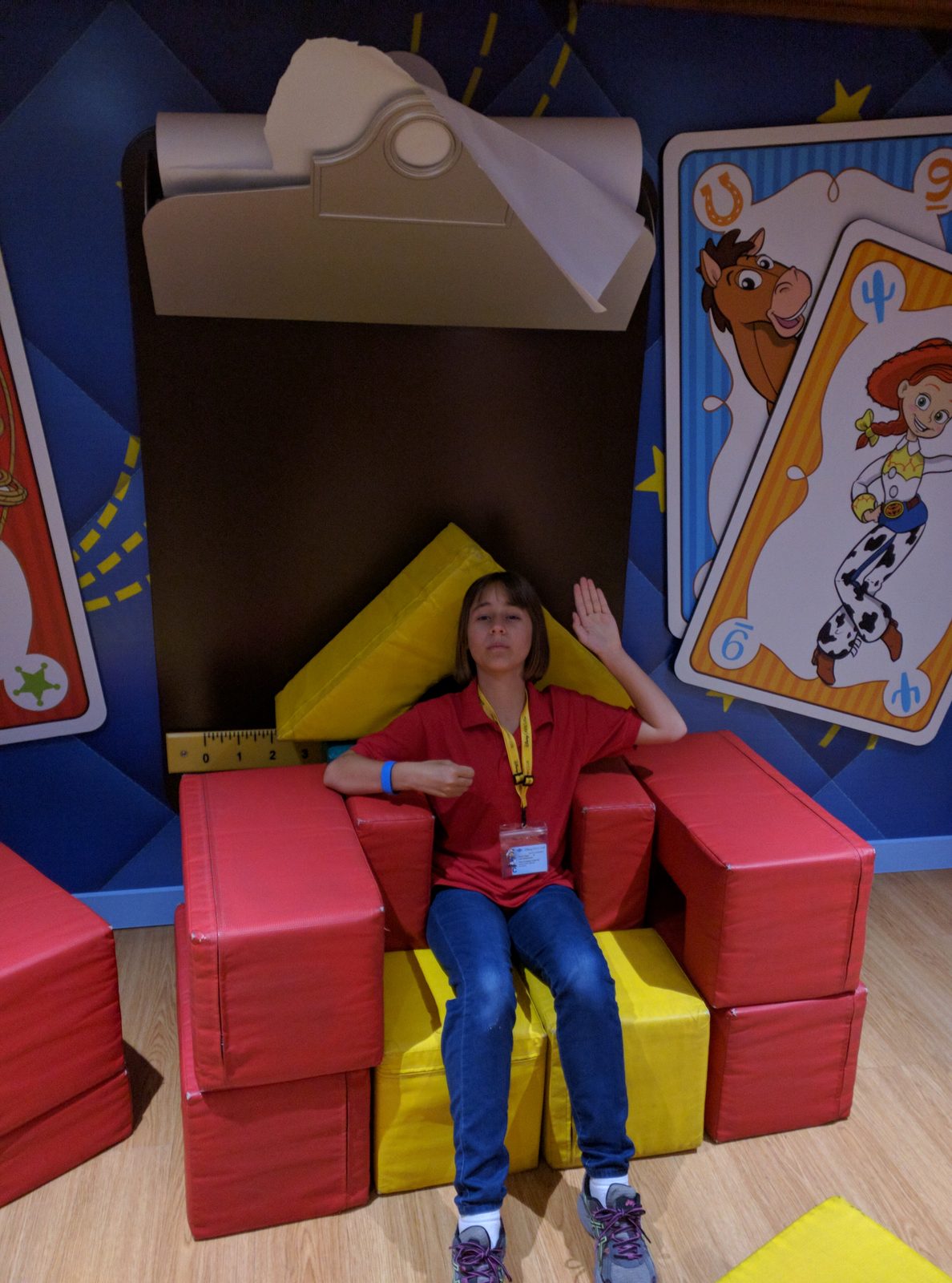 Lisa lounging in a big chair in the kids club
