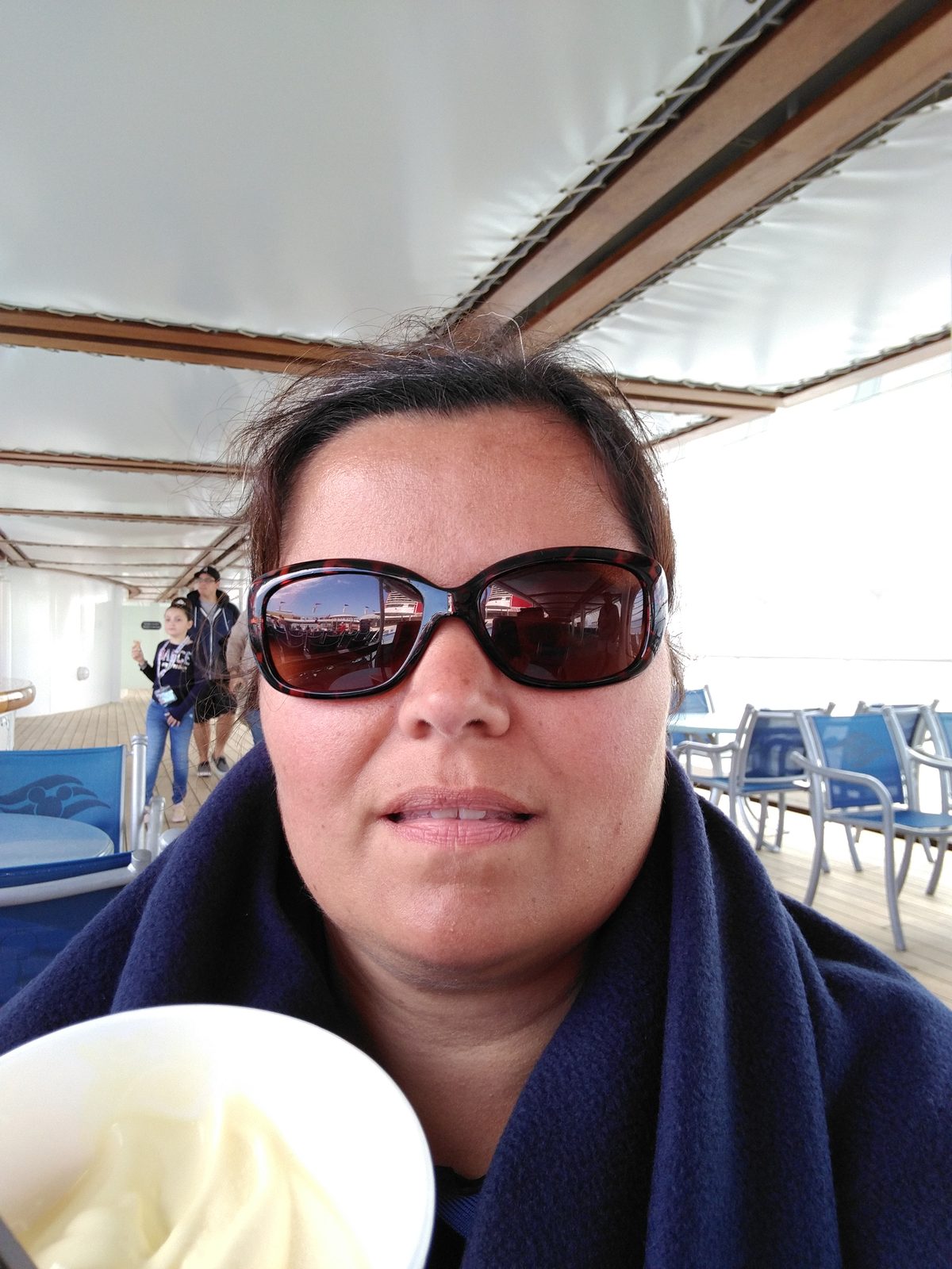 Kathy with a cold drink on deck