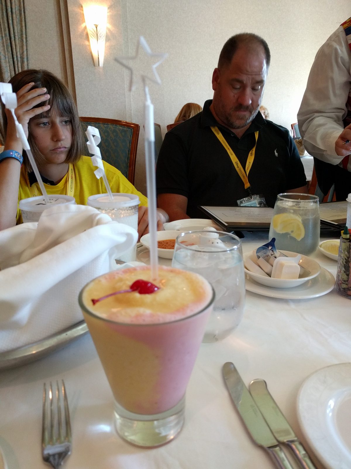 Thomas celebrates with a mocktail and a candle