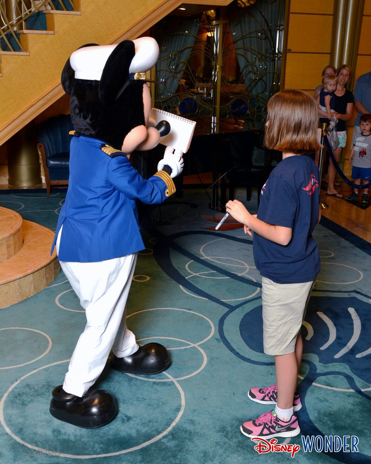 Lisa getting an autograph from Captain Mickey in the Lobby Atrium