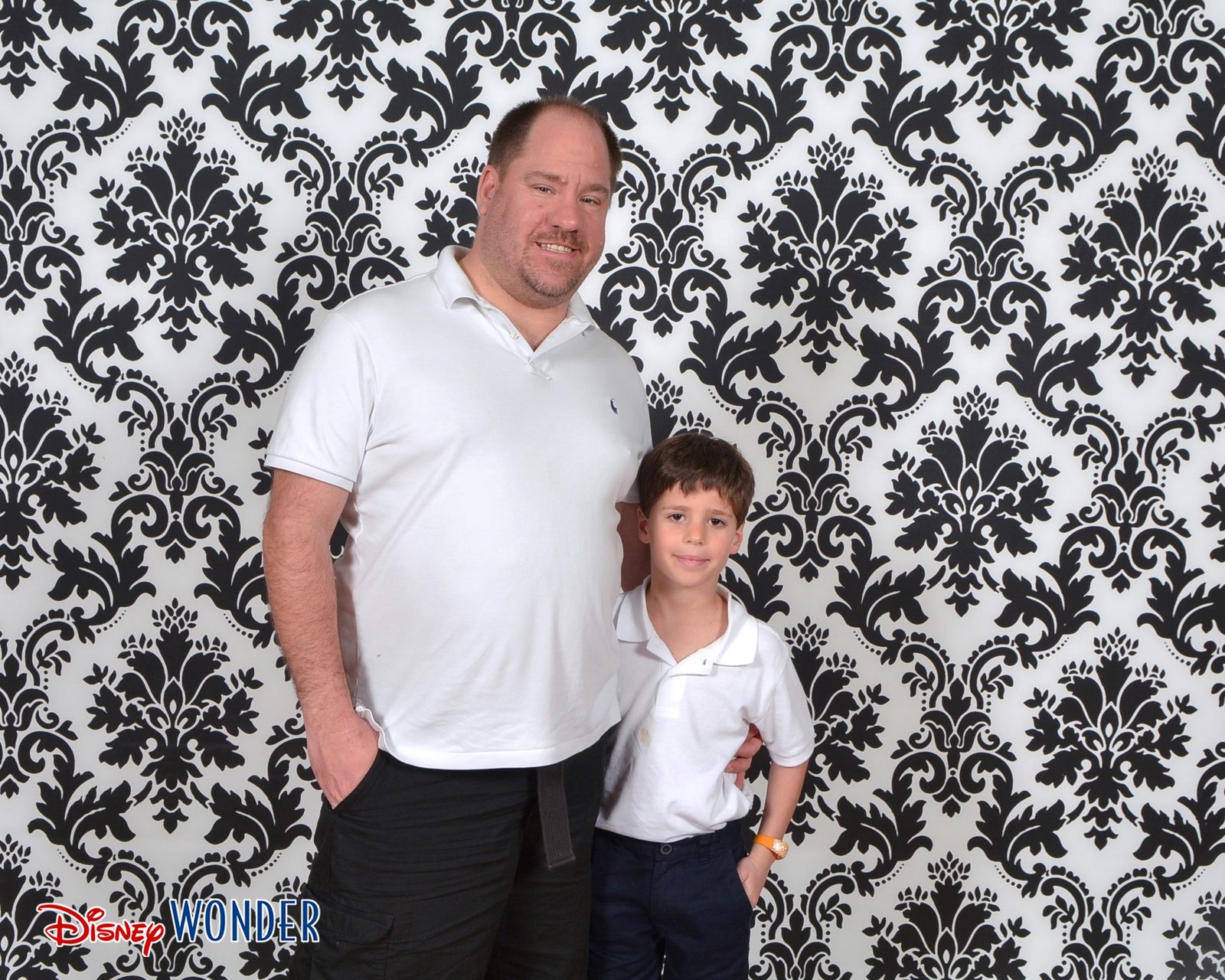 Thomas and Michael in front of the damask backdrop