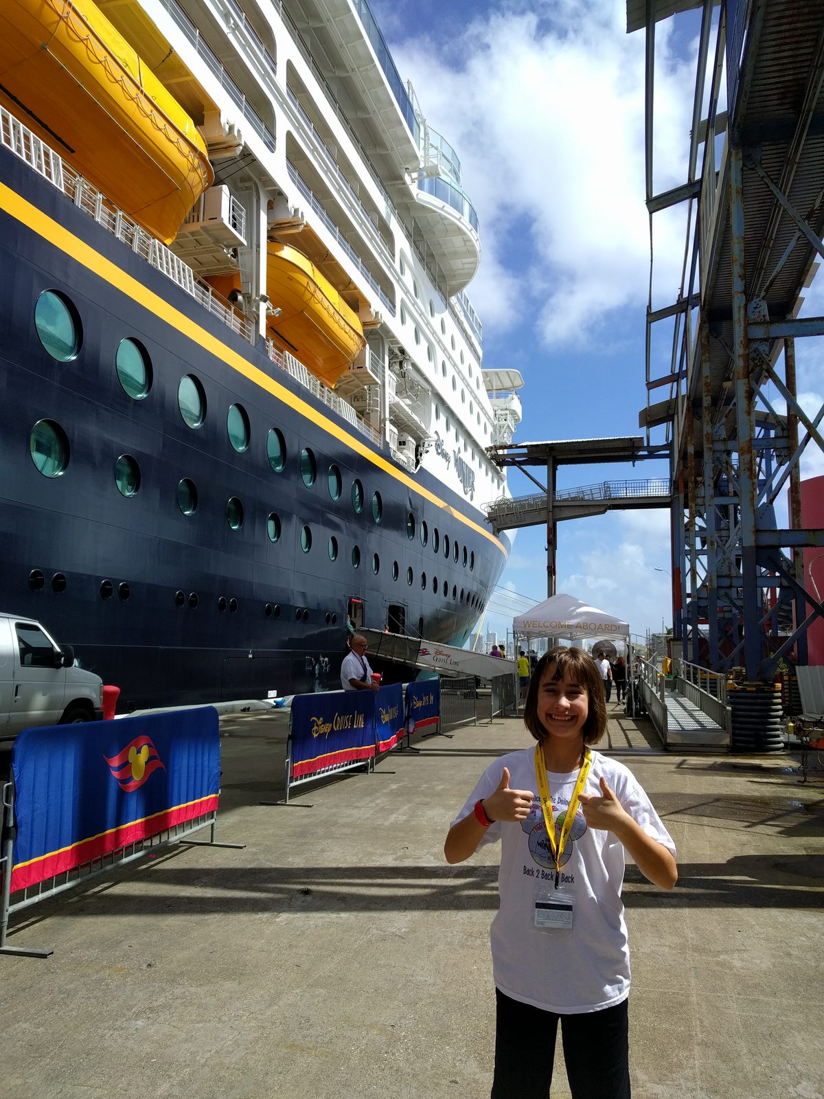 Lisa at the pier beside the Disney Wonder