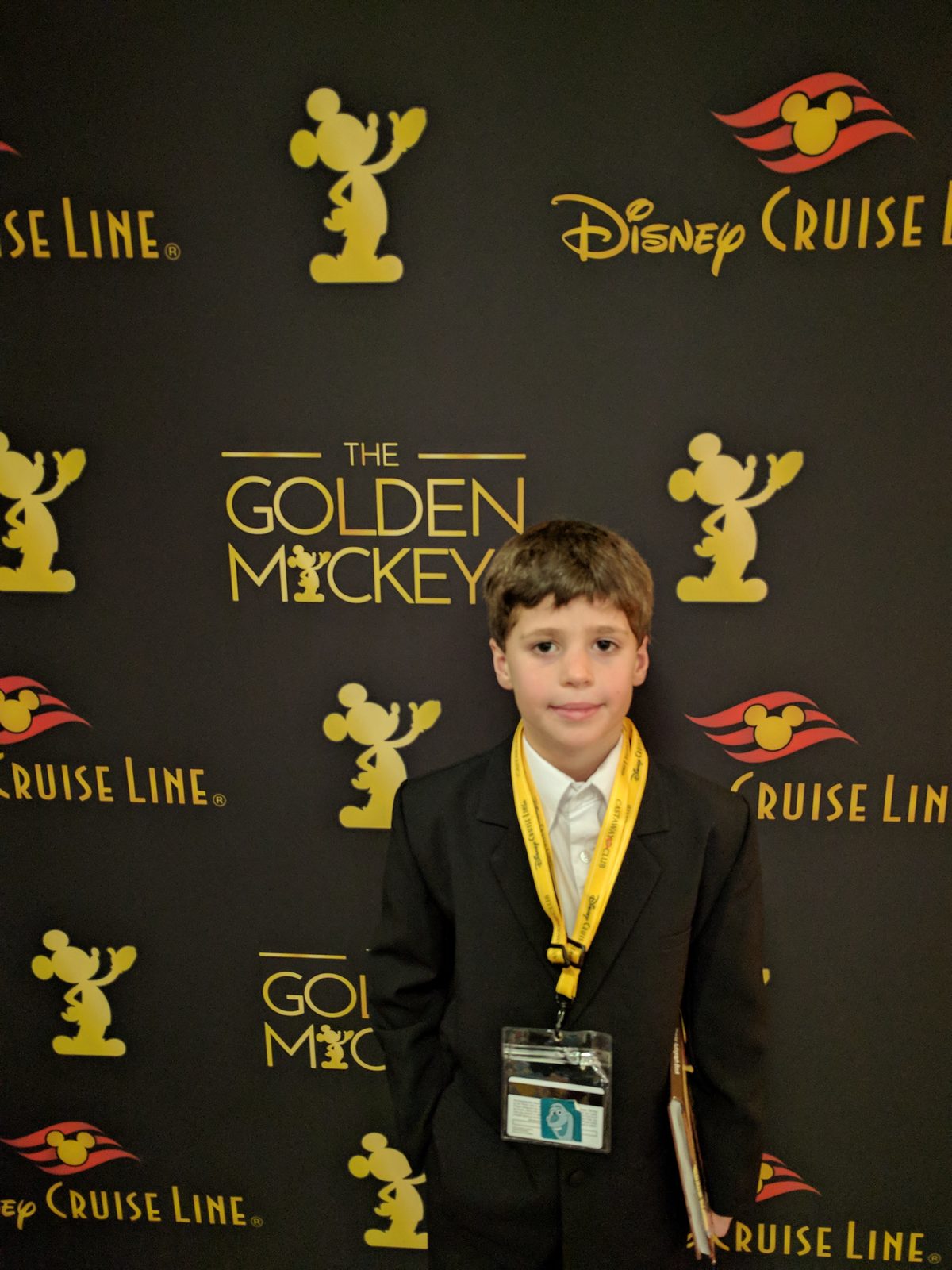 Thomas at the Golden Mickeys backdrop on formal night