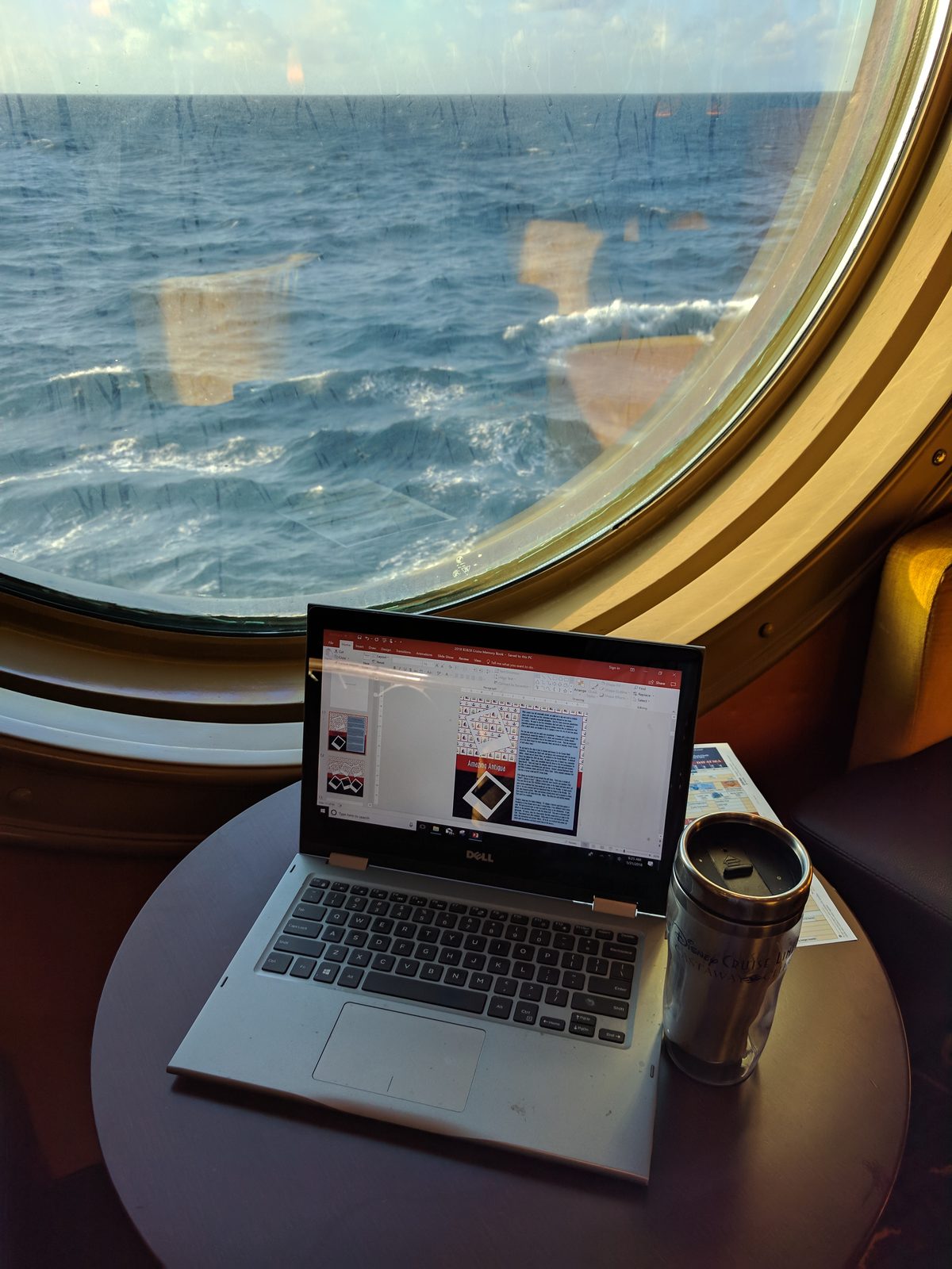 Coffee and Kathy's laptop by the porthole