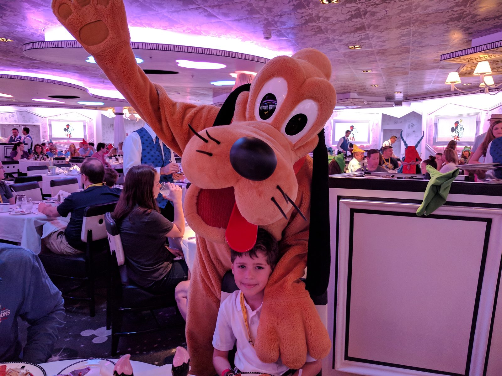 Pluto stops by Thomas at breakfast