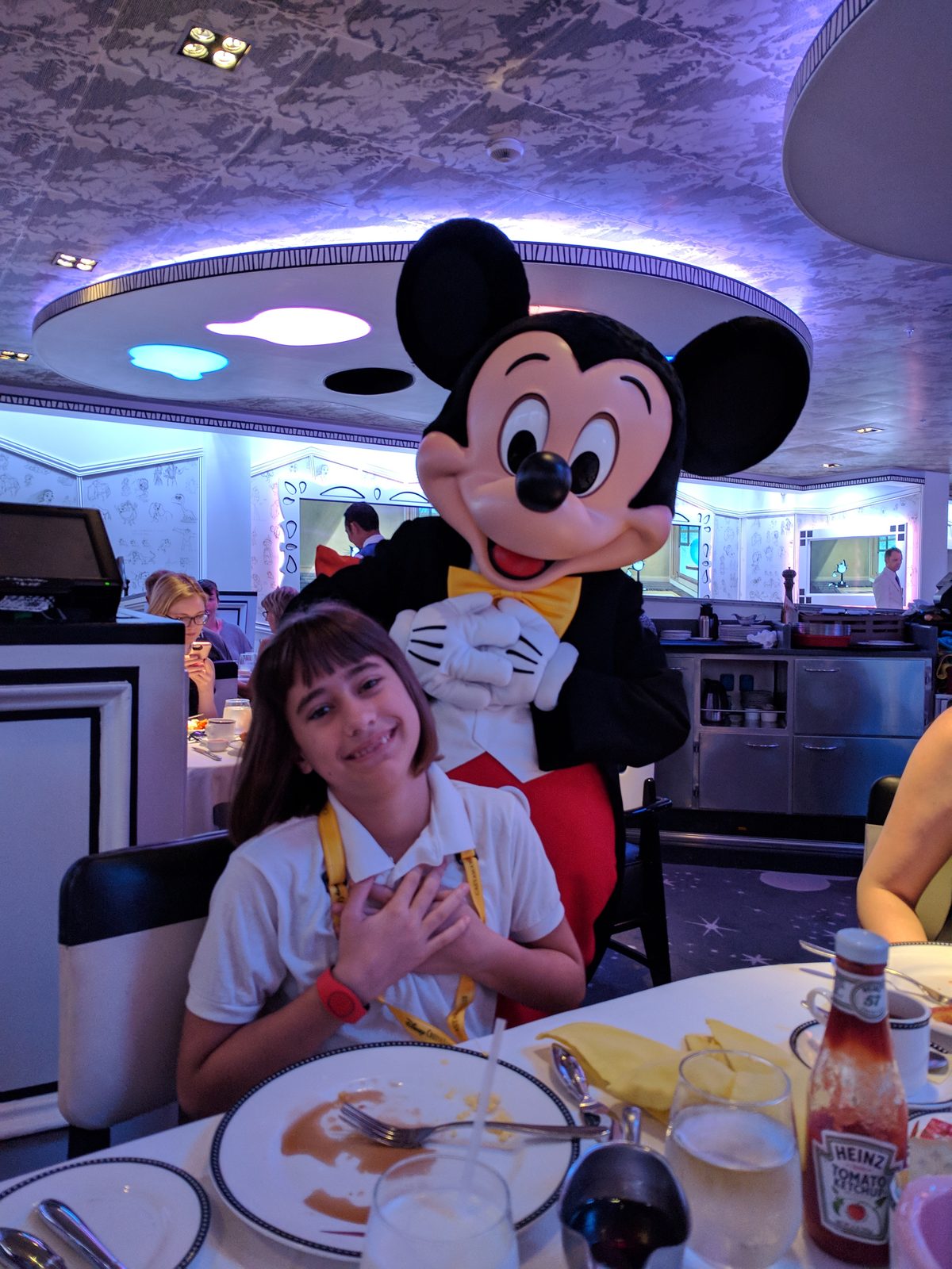 Lisa with Mickey at breakfast on the Wonder