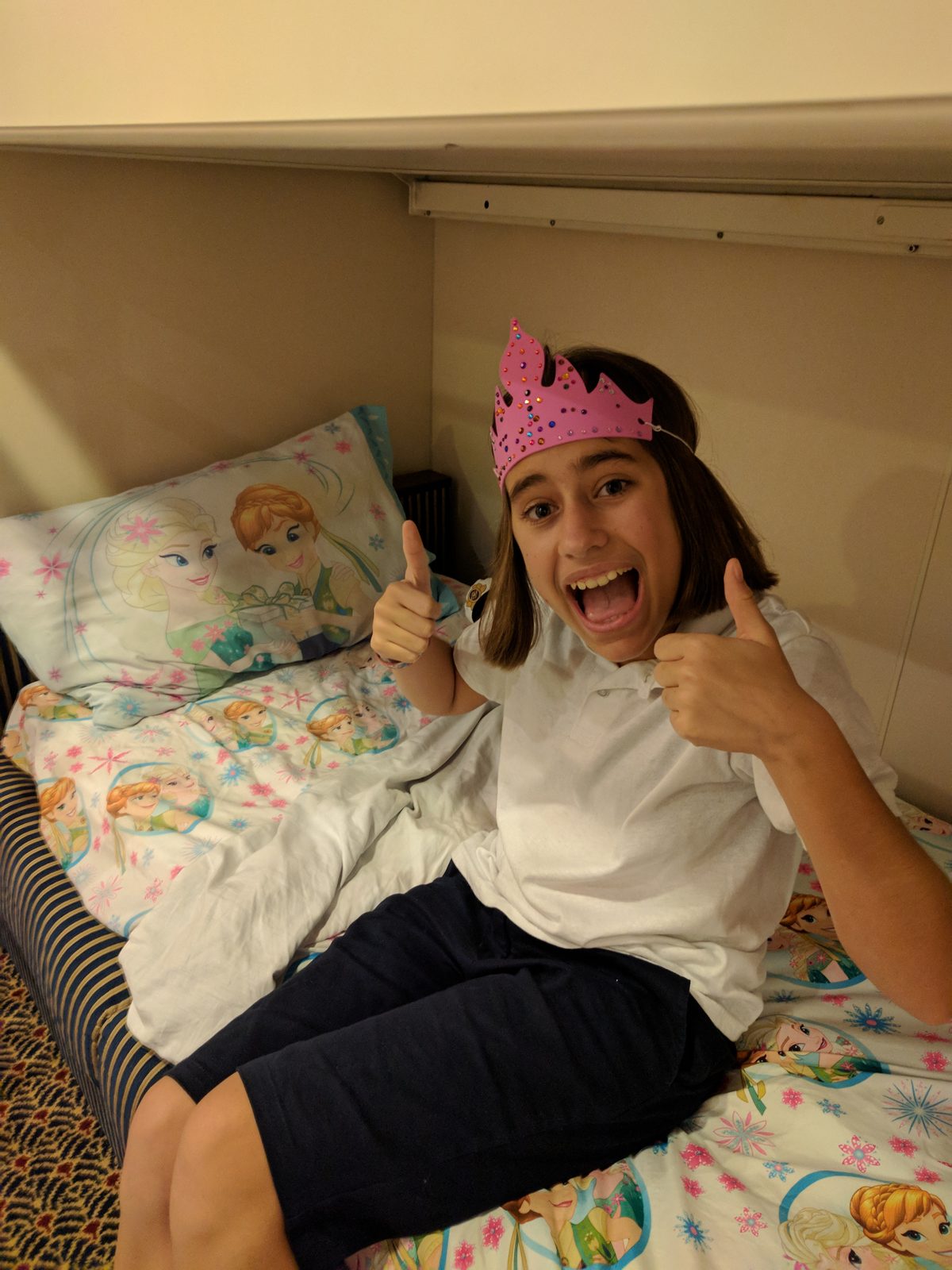 Lisa in a paper crown before bed
