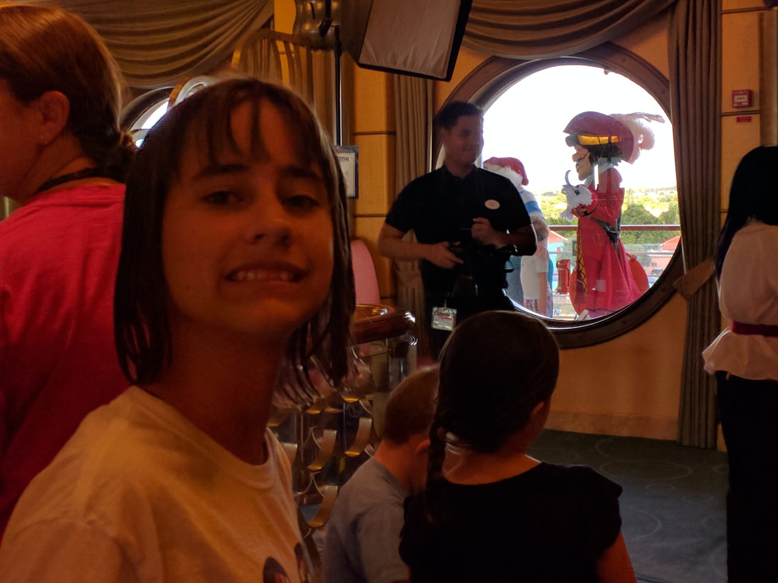 Lisa with Captain Hook outside the porthole window in Bonaire