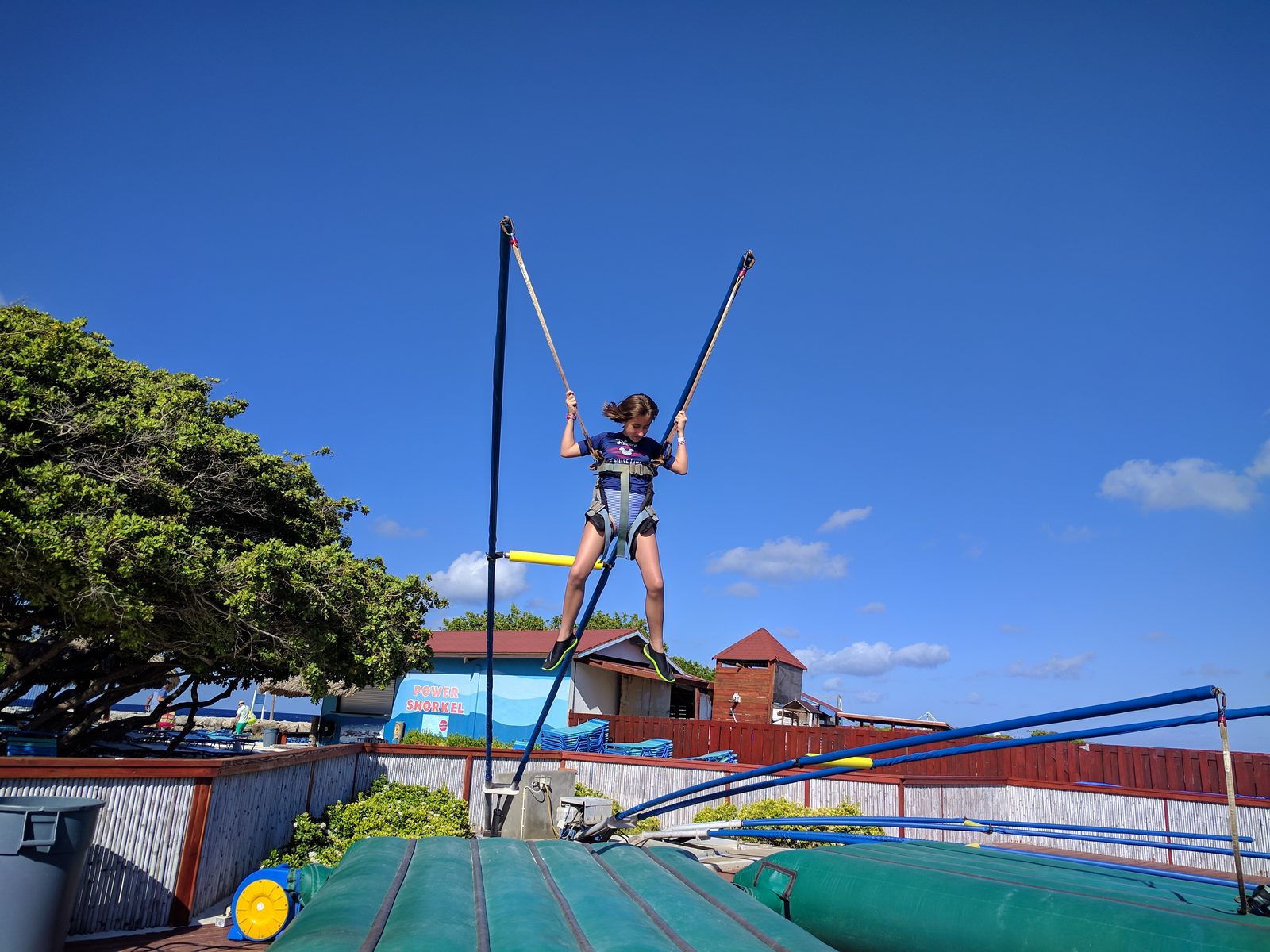 Lisa on the bungee trampoline at De Palm Island