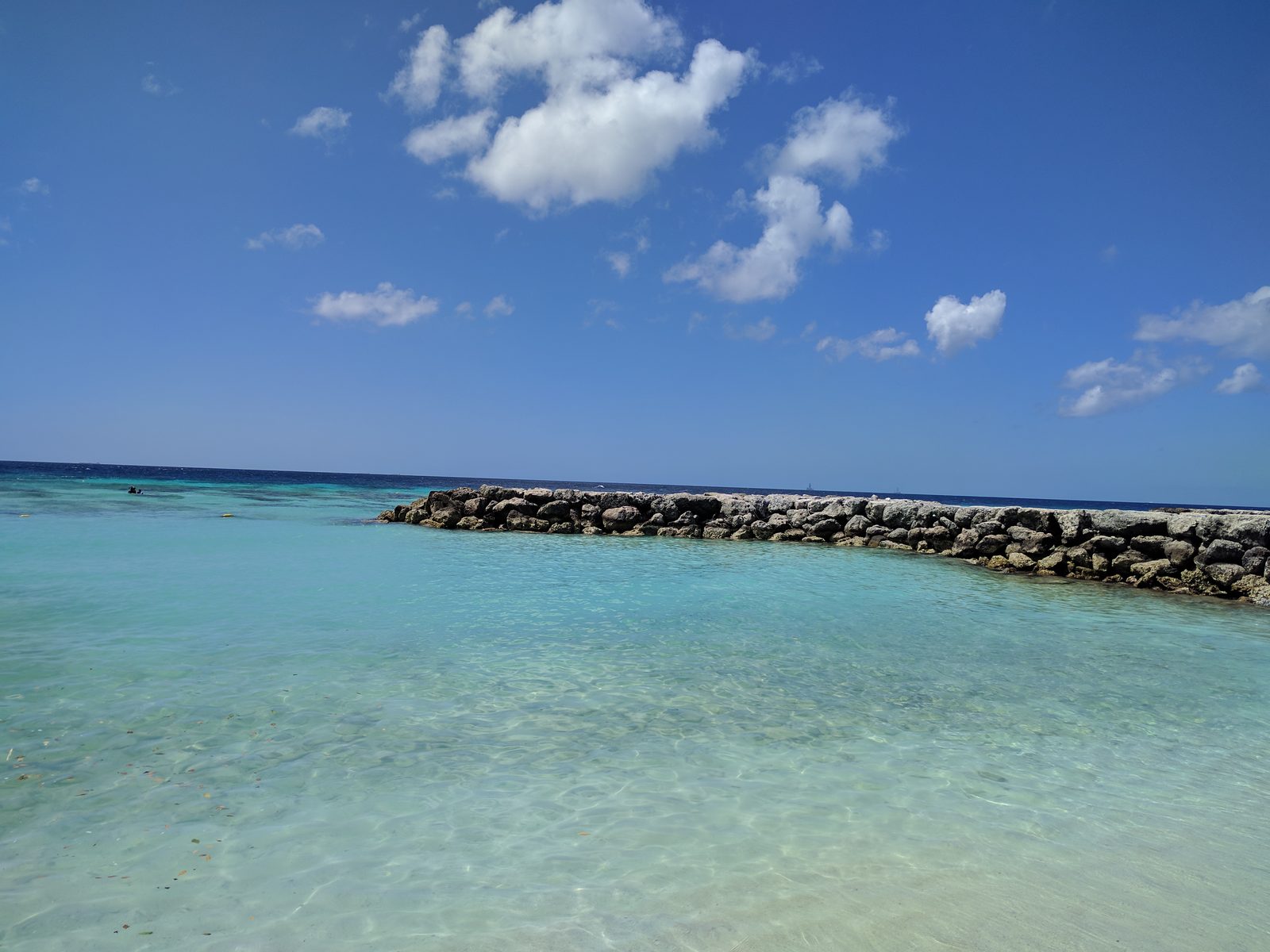Clear water and the breakwater at De Palm Island