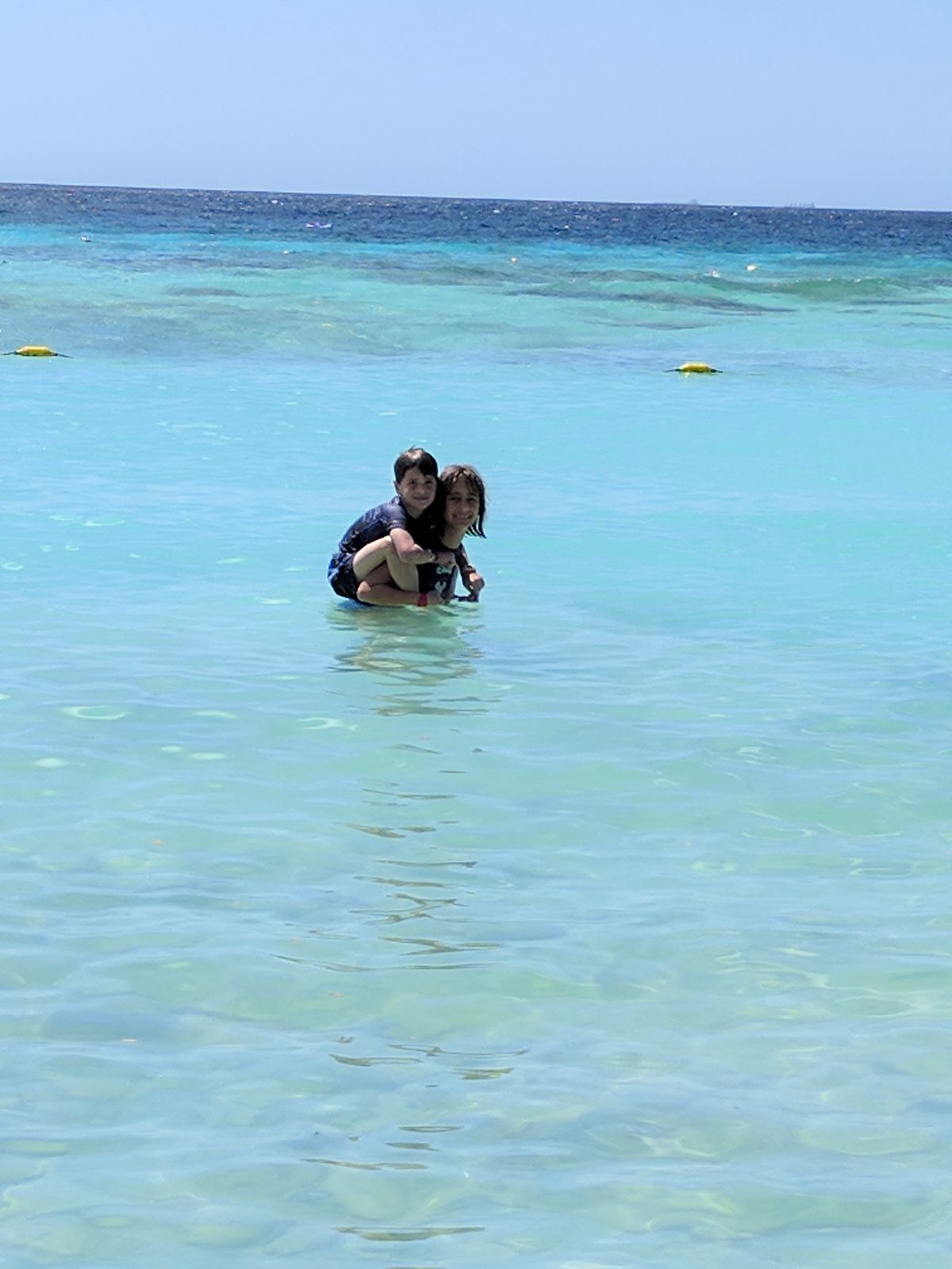 Lisa and Thomas cooling off in the shallow water