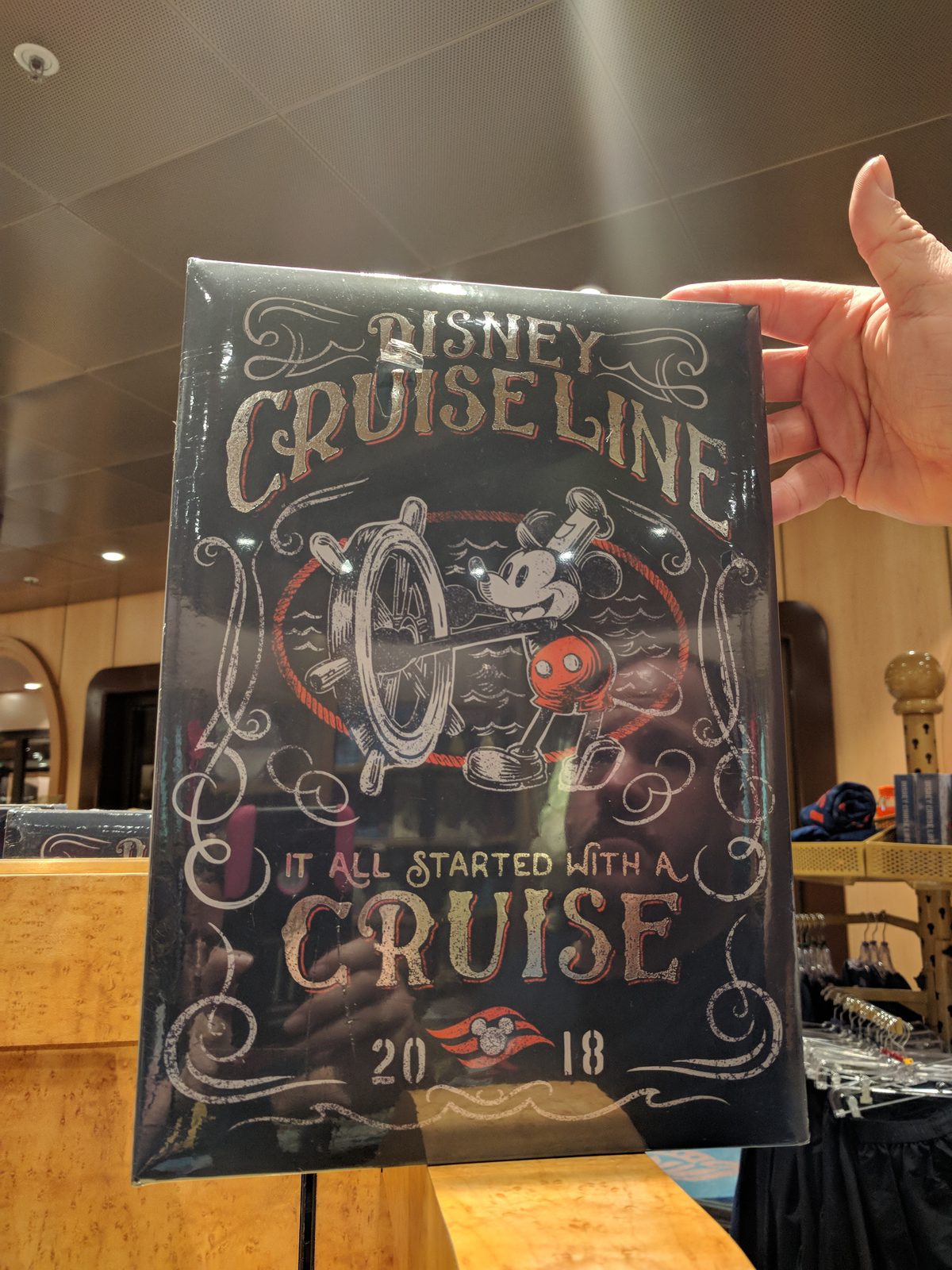 Kathy holds up our cruise keepsake print