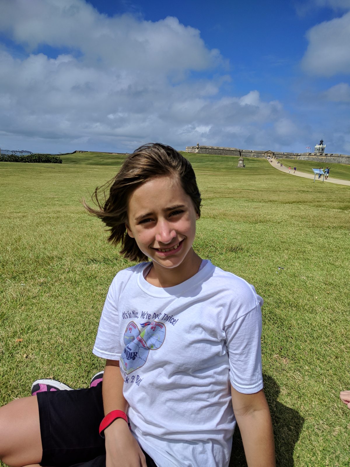Lisa on the grass at Castillo San Cristobal