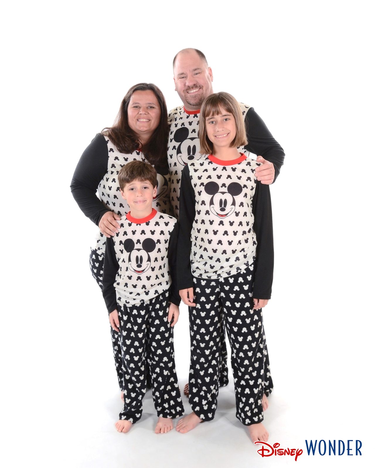 The four of us lined up in Mickey pajamas