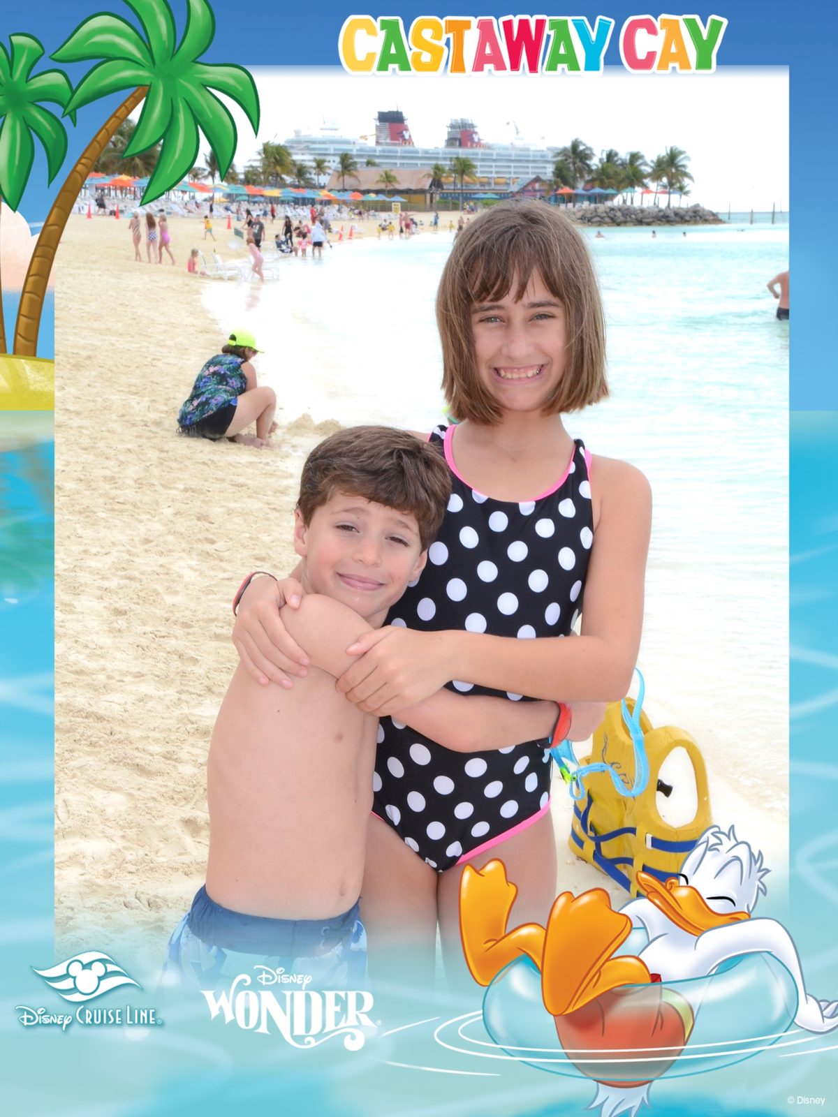 Thomas and Lisa hugging on the beach at Castaway Cay
