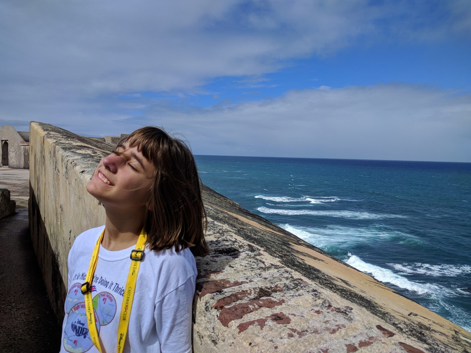 Lisa on the fort wall above the water