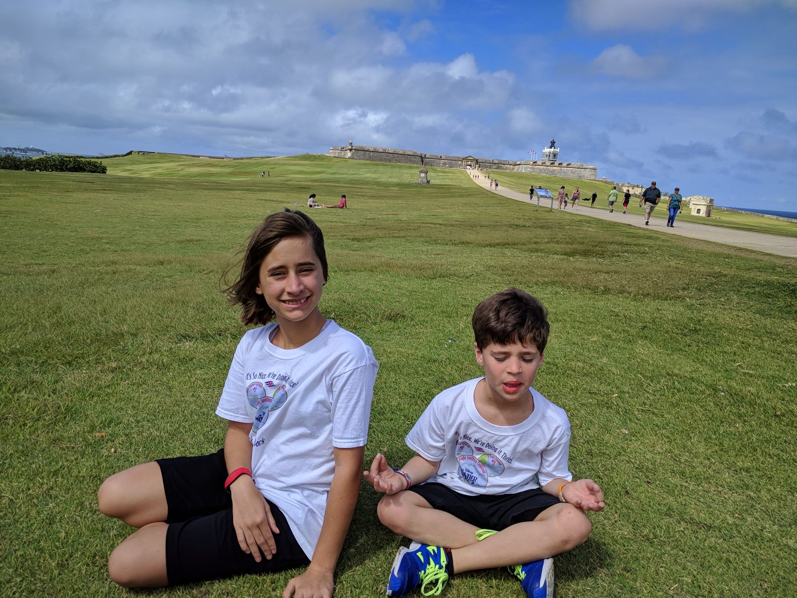 The kids on the lawn by the fort