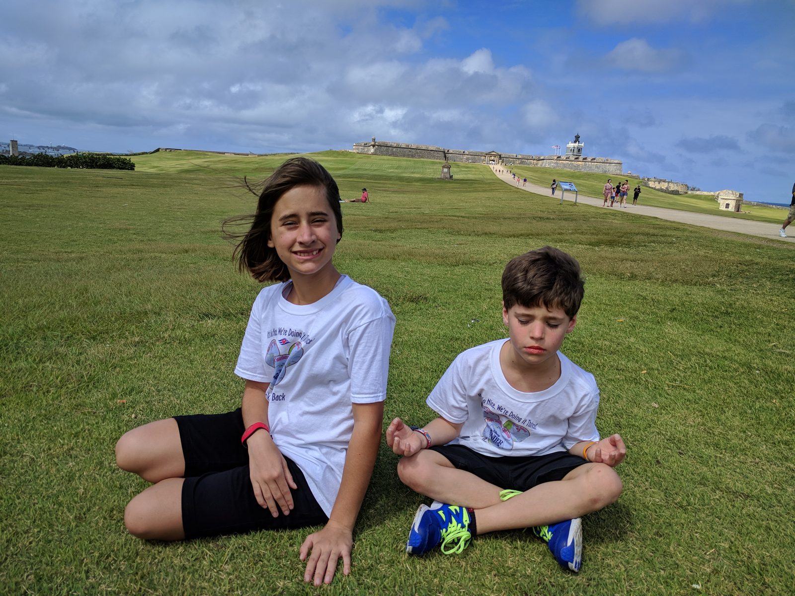 Lisa and Thomas sitting on the fort's lawn
