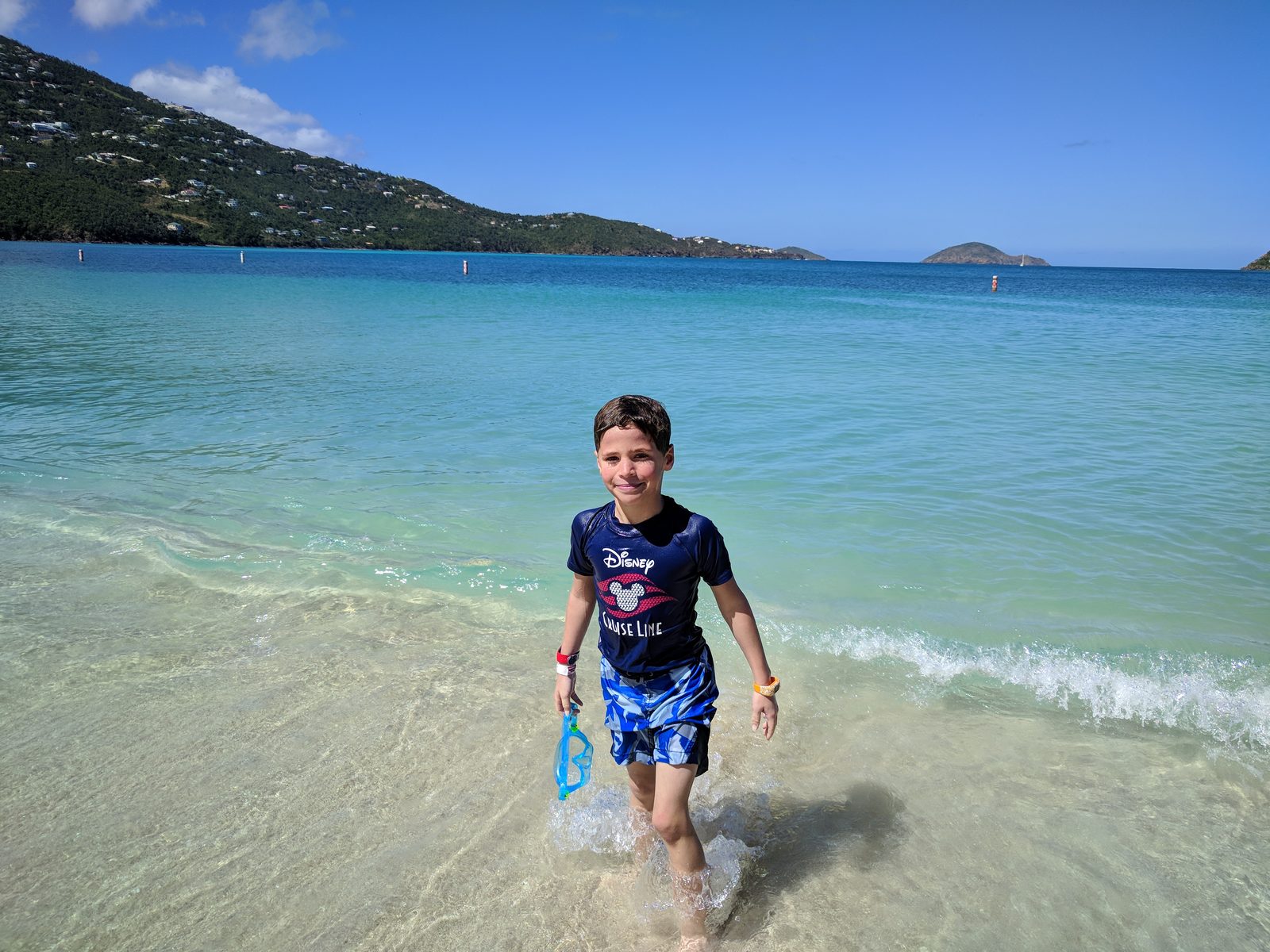 Thomas wading into the turquoise water