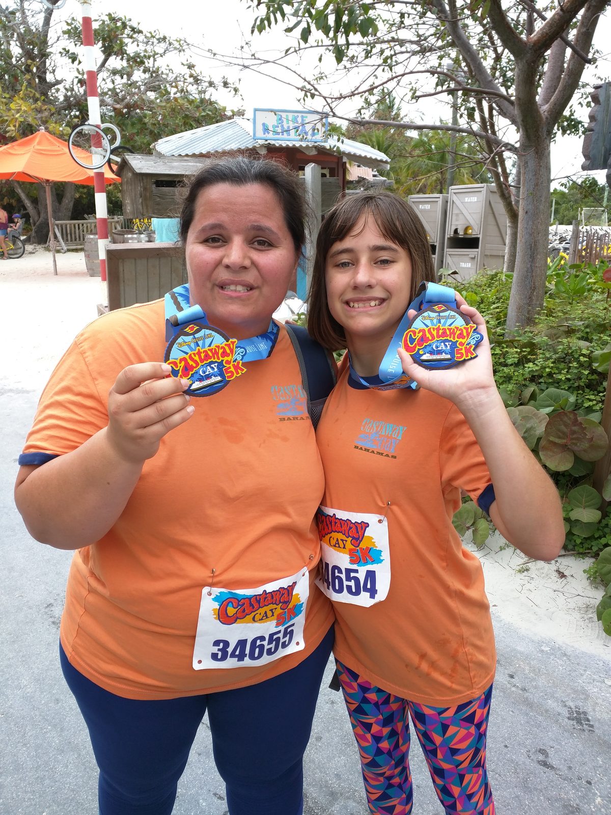 Kathy and Lisa with their Castaway Cay 5K medals