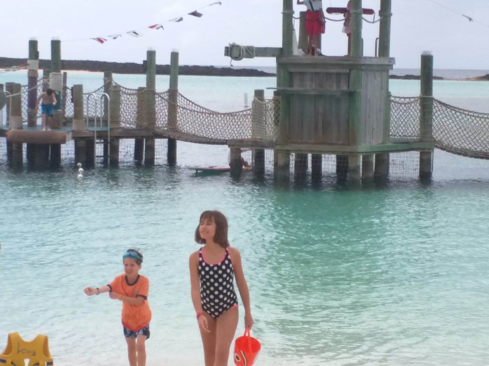 The kids wading by the platform at Castaway Cay