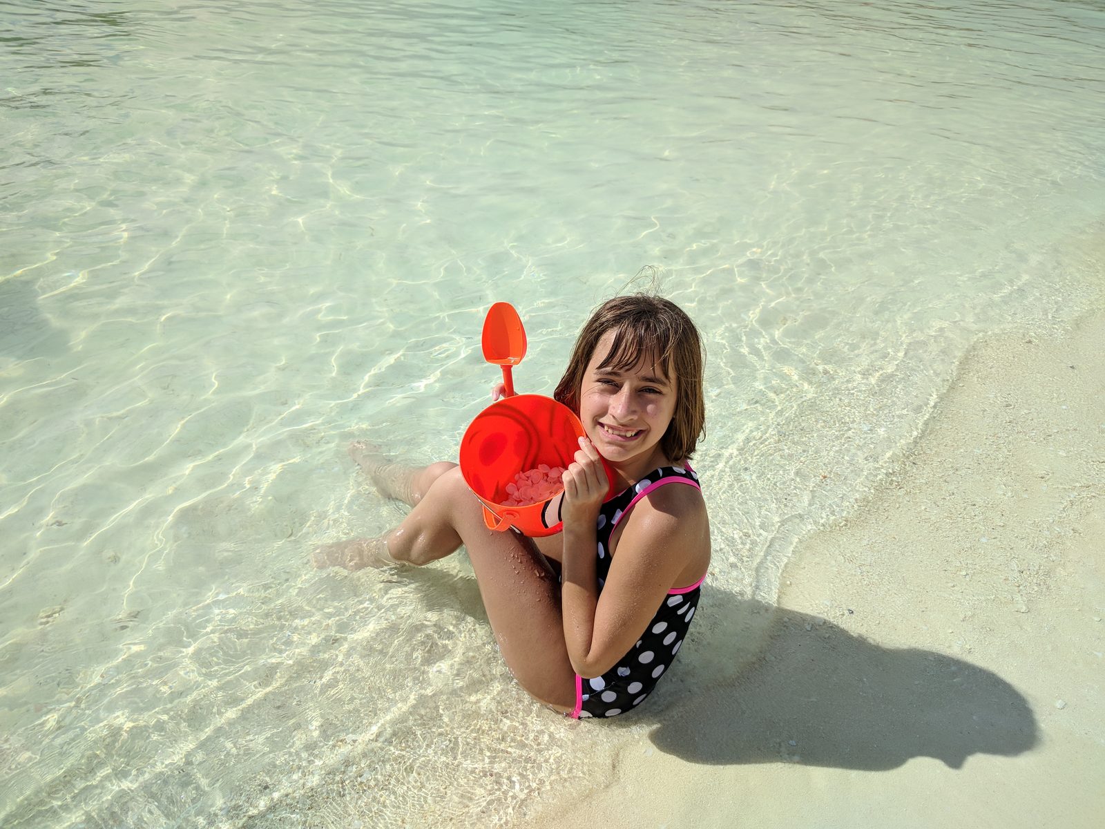 Lisa in the shallows with her bucket