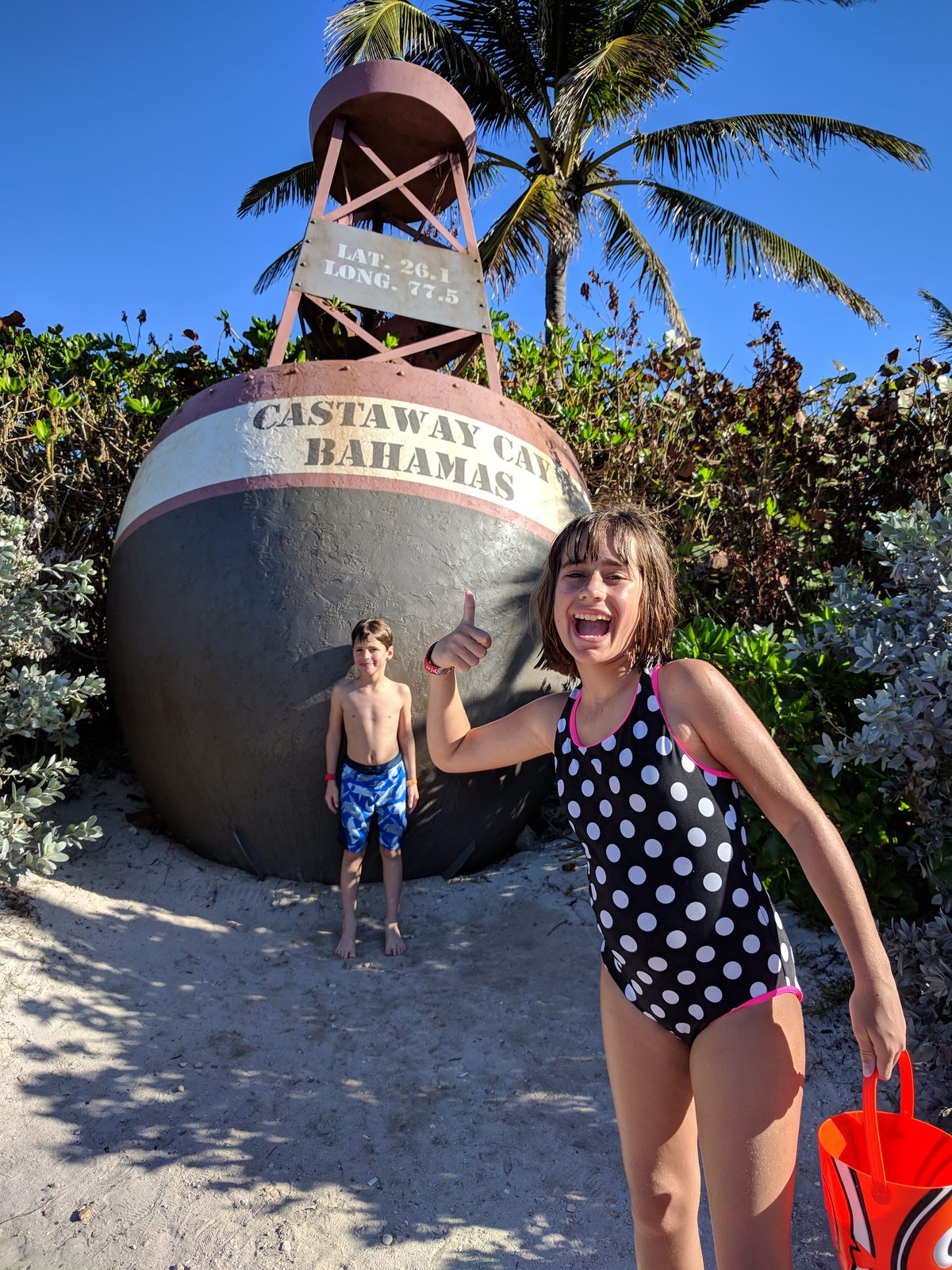 At the Castaway Cay sign