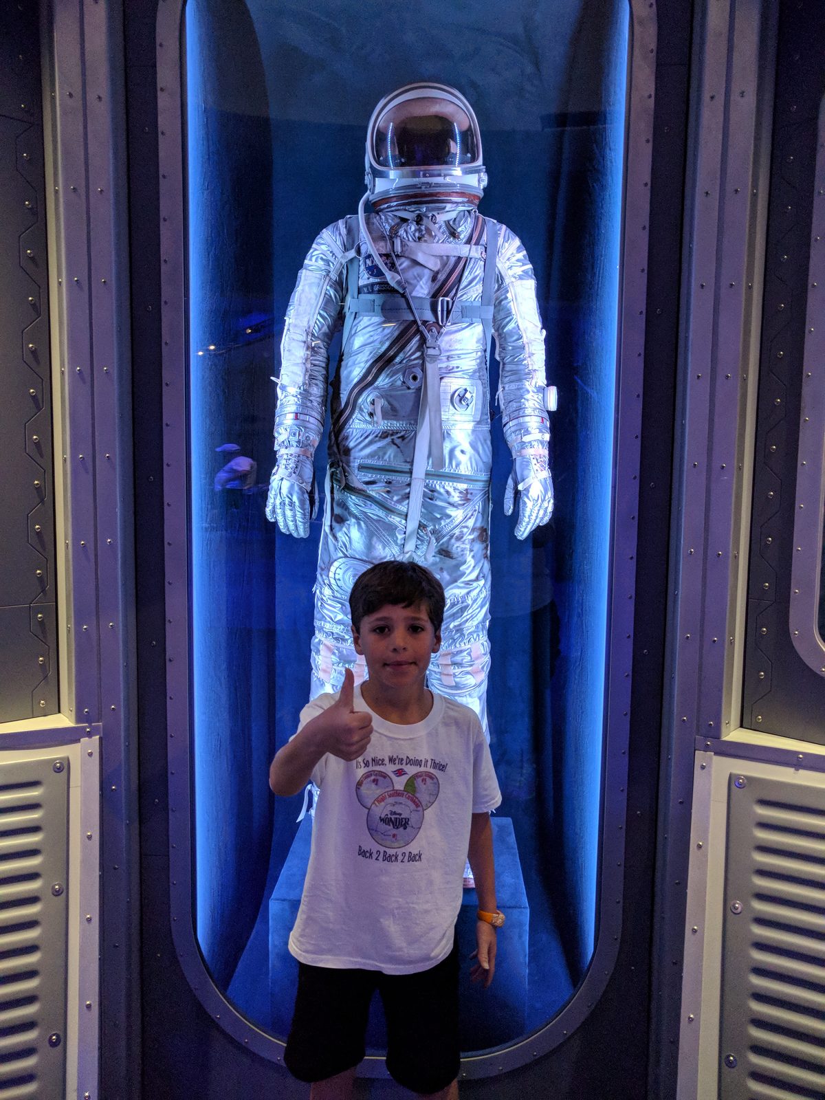 Thomas thumbs up inside the astronaut training chamber