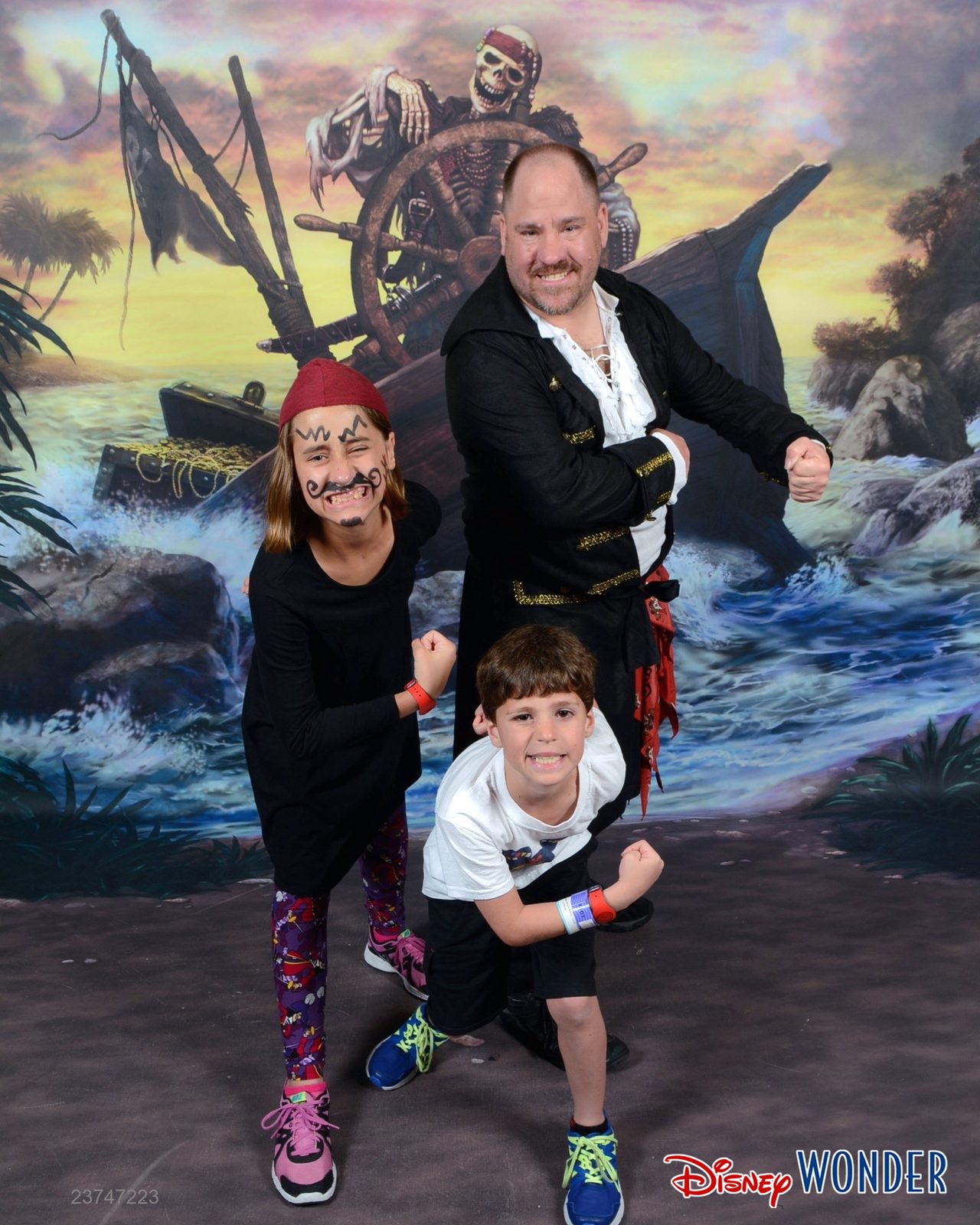 Lisa, Thomas and Michael at the shipwreck backdrop on Pirate Night