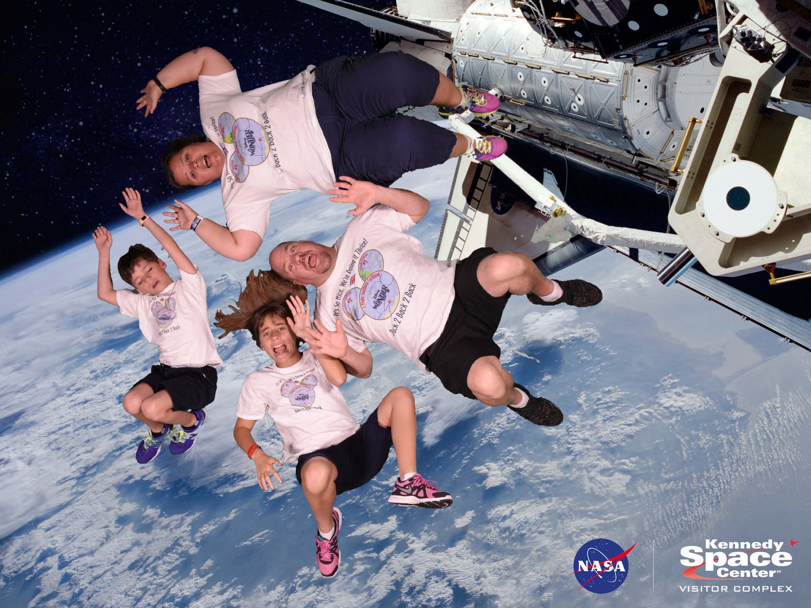 Lisa, Thomas and me reaching for the shuttle arm
