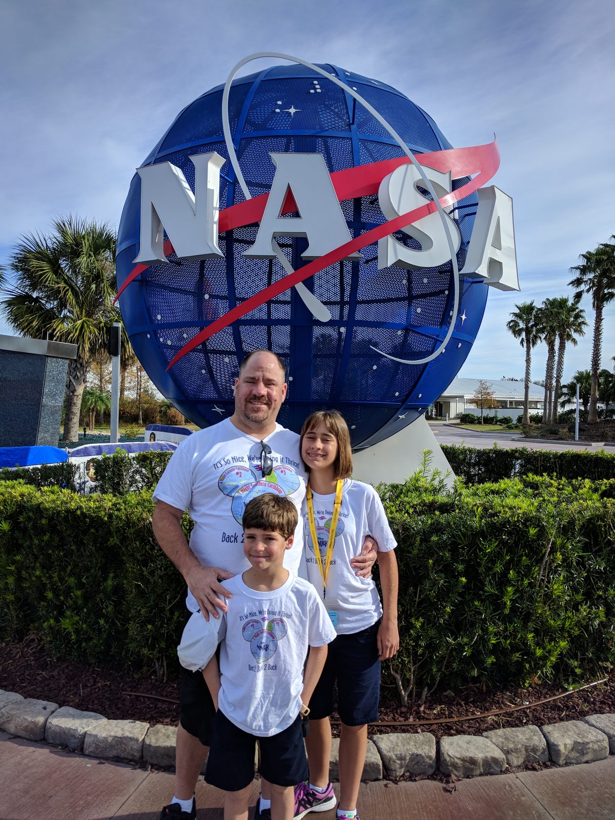 The family at Kennedy Space Center's globe sign