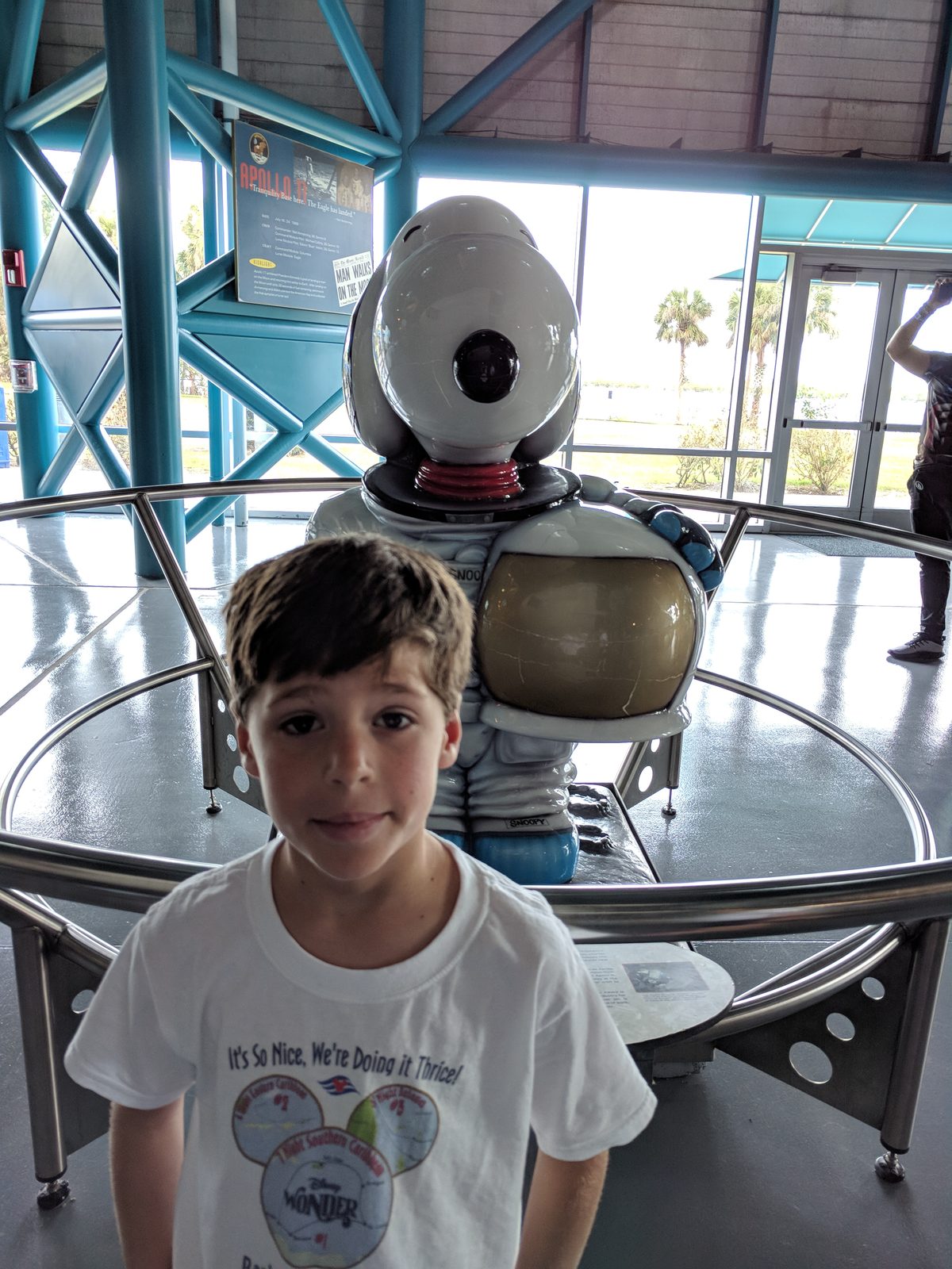 Thomas beside a Mercury capsule replica