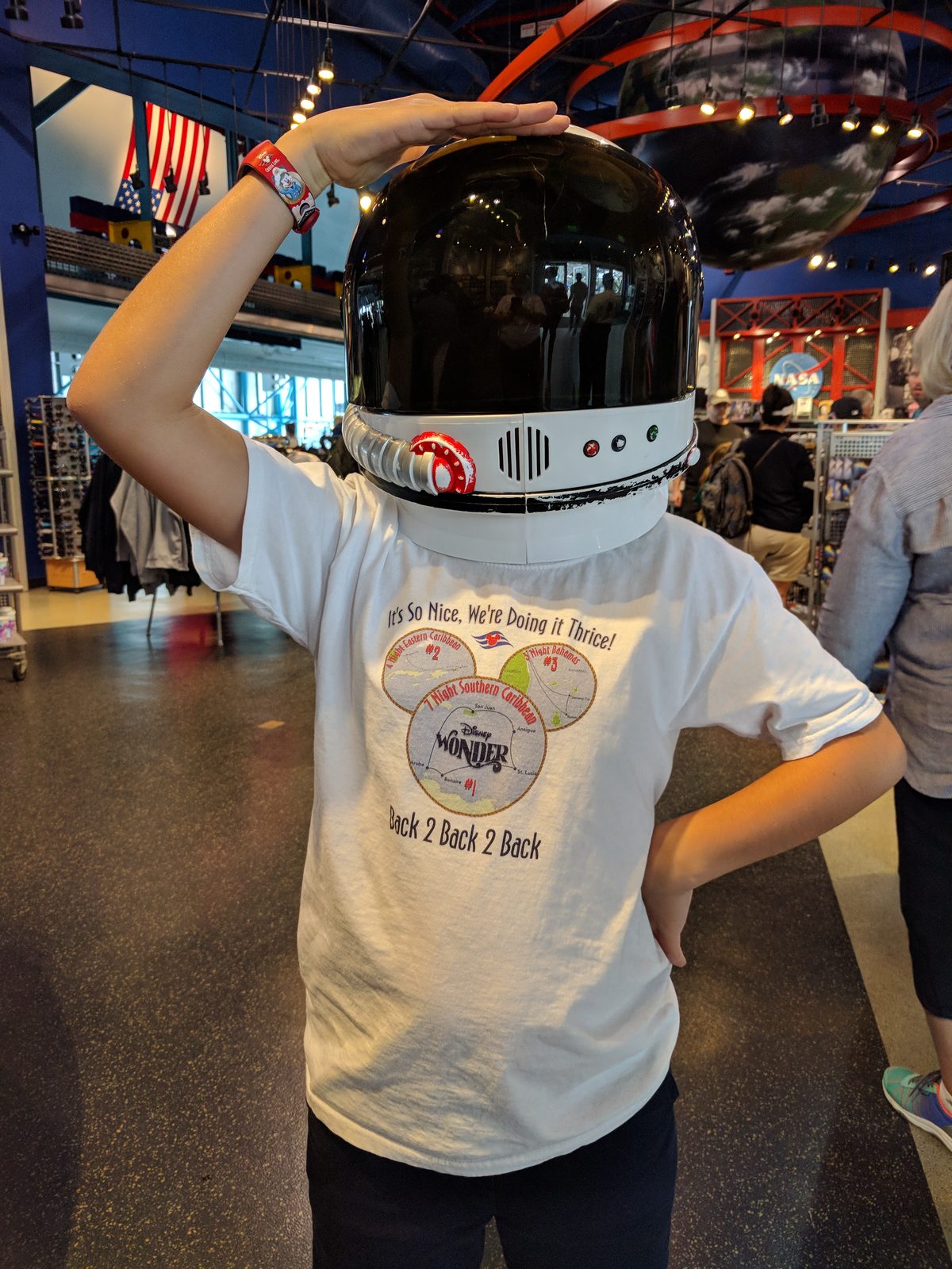 Thomas trying on a kid-sized astronaut helmet