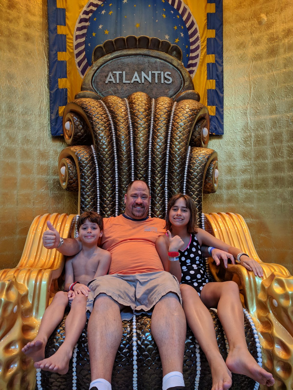 The kids and Michael on the Atlantis throne