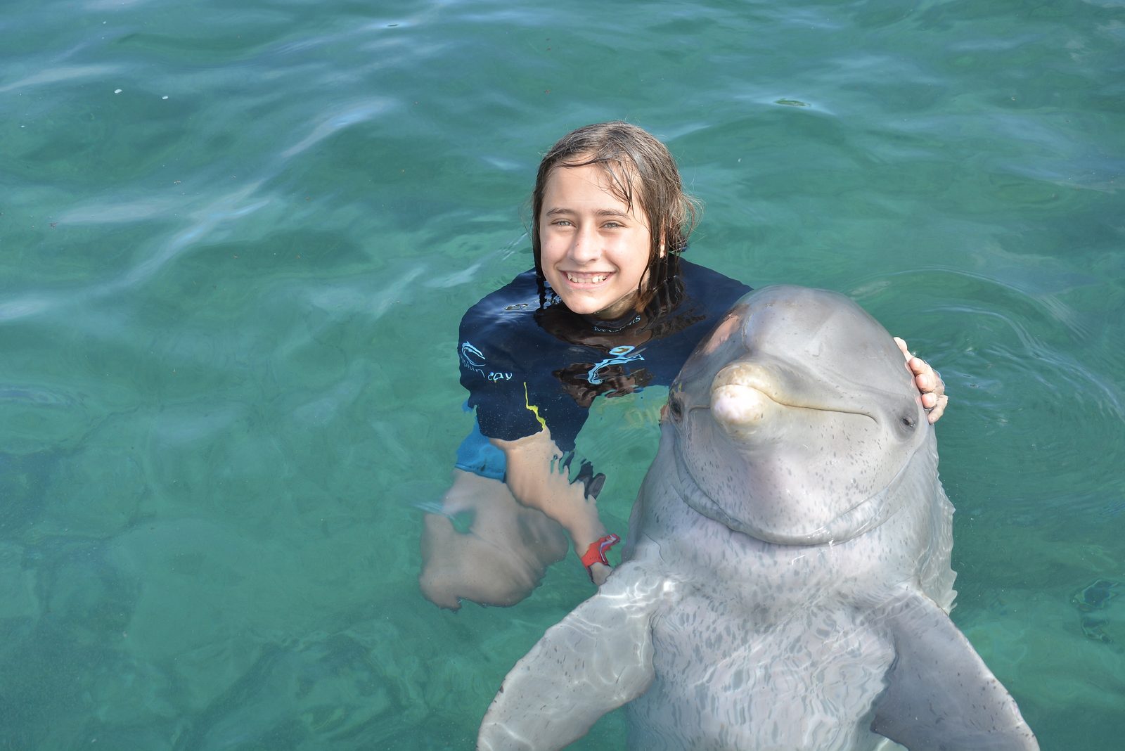 Lisa face to face with a dolphin
