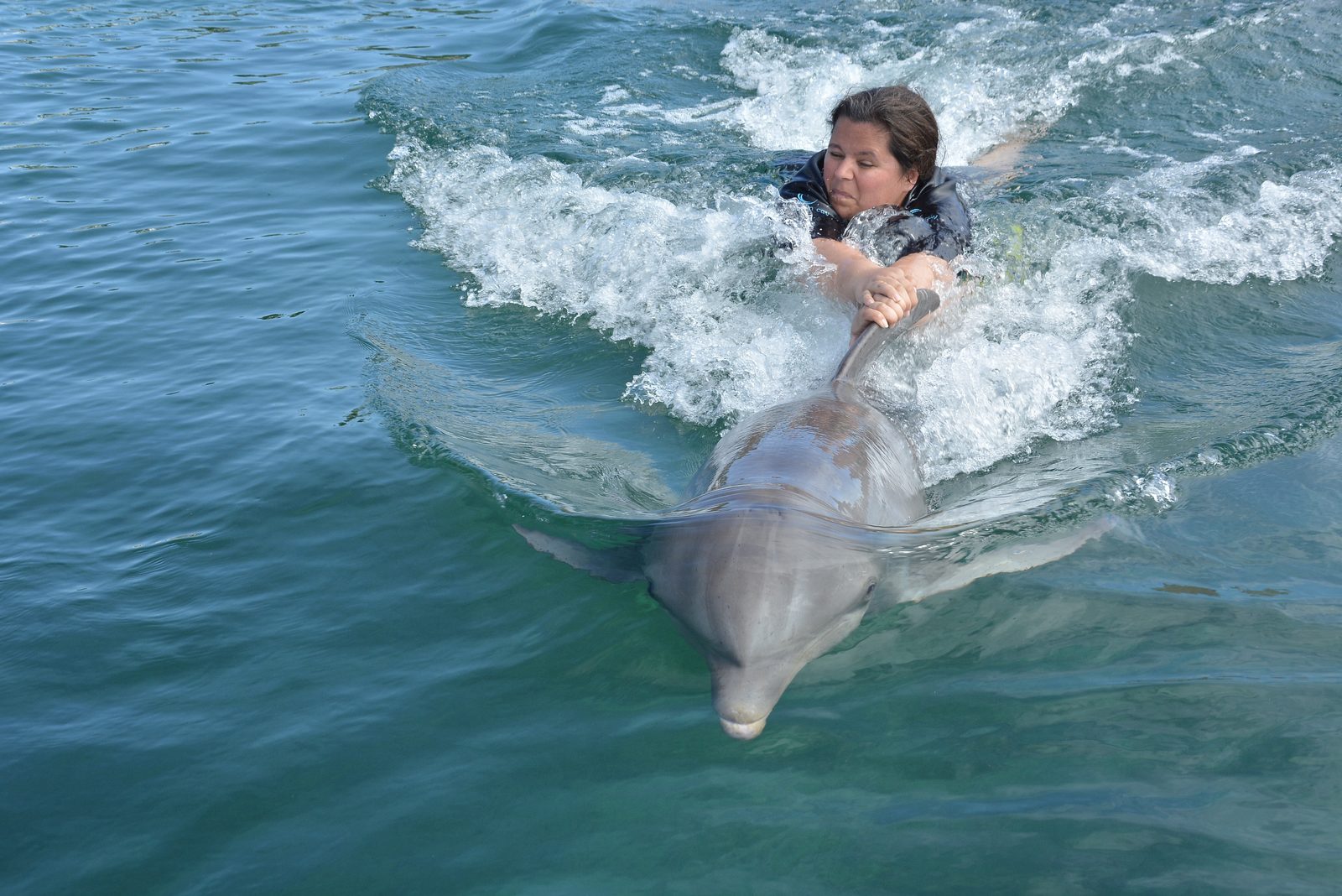 Kathy on a fast dolphin ride at Dolphin Cay