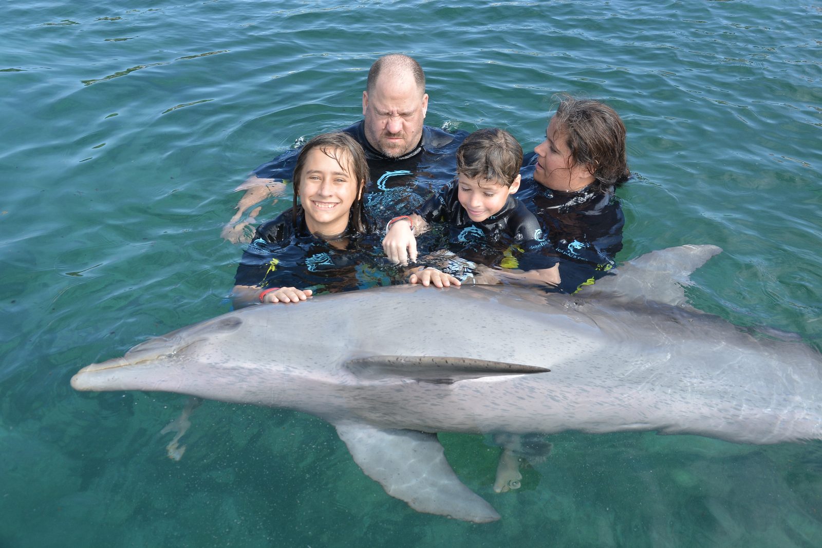 The four of us with the dolphin at Dolphin Cay